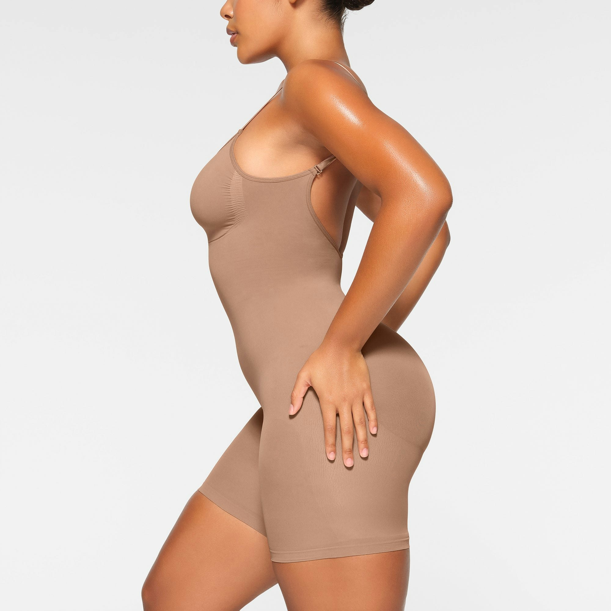 SEAMLESS SCULPT LOW BACK MID THIGH BODYSUIT ON A MODEL BACK VIEW