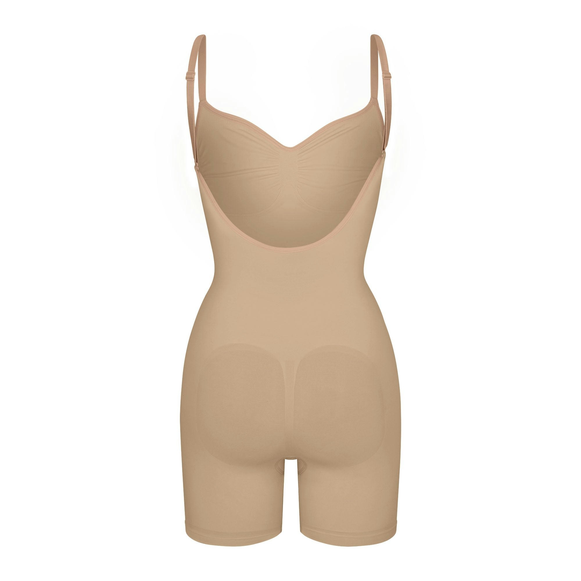 SEAMLESS SCULPT LOW BACK MID THIGH BODYSUIT LAYS FLAT ON A WHITE BACKGROUND | FLT