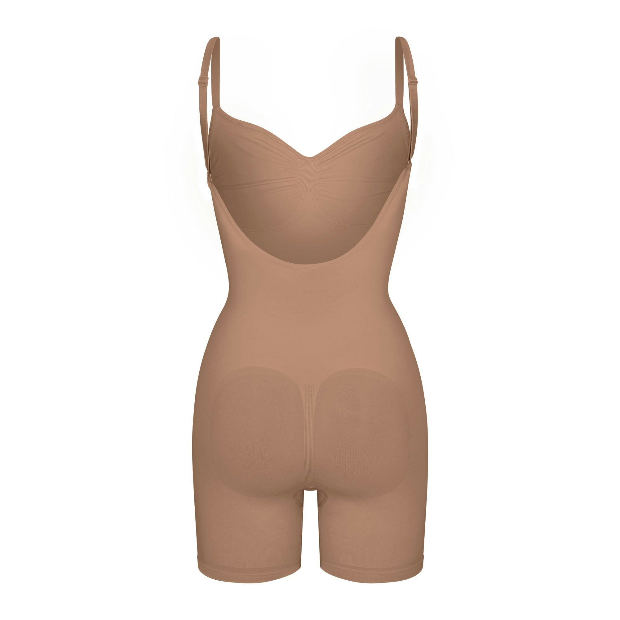 SEAMLESS SCULPT LOW BACK MID THIGH BODYSUIT LAYS FLAT ON A WHITE BACKGROUND | FLT