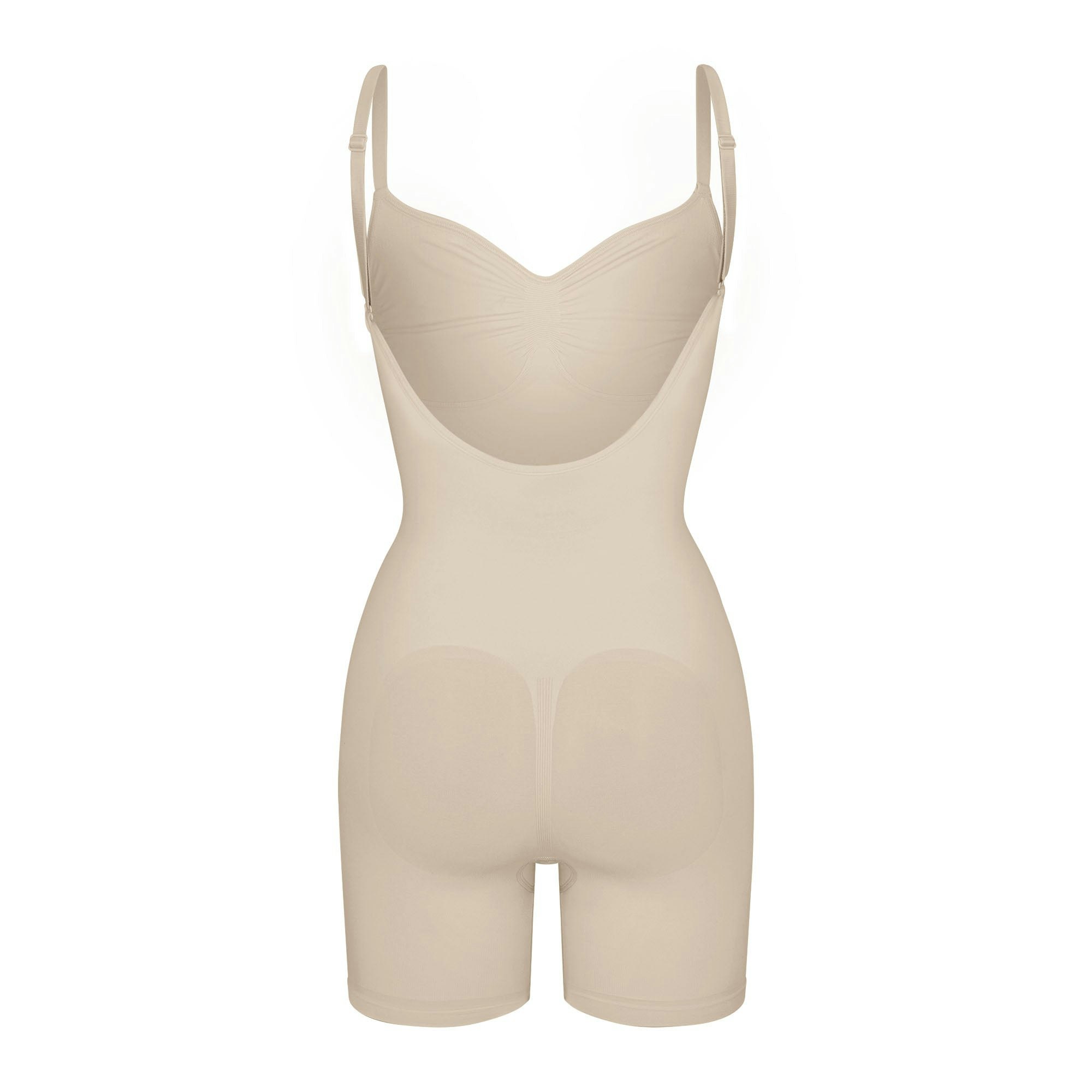 SEAMLESS SCULPT LOW BACK MID THIGH BODYSUIT LAYS FLAT ON A WHITE BACKGROUND | FLT