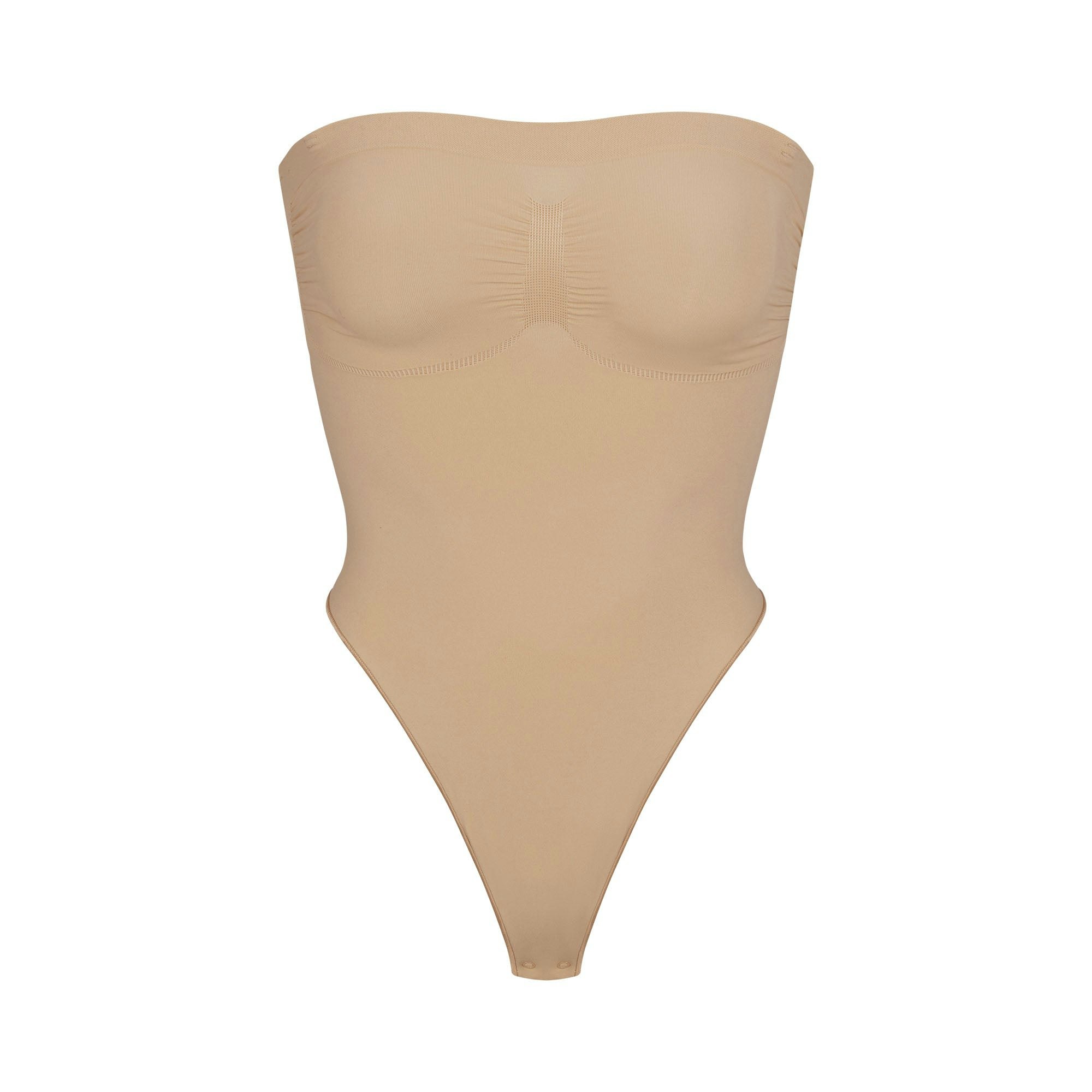 SEAMLESS SCULPT STRAPLESS THONG BODYSUIT | CLAY (SHAPEWEAR BODYSUITS) LAYS FLAT ON A WHITE BACKGROUND | FLT