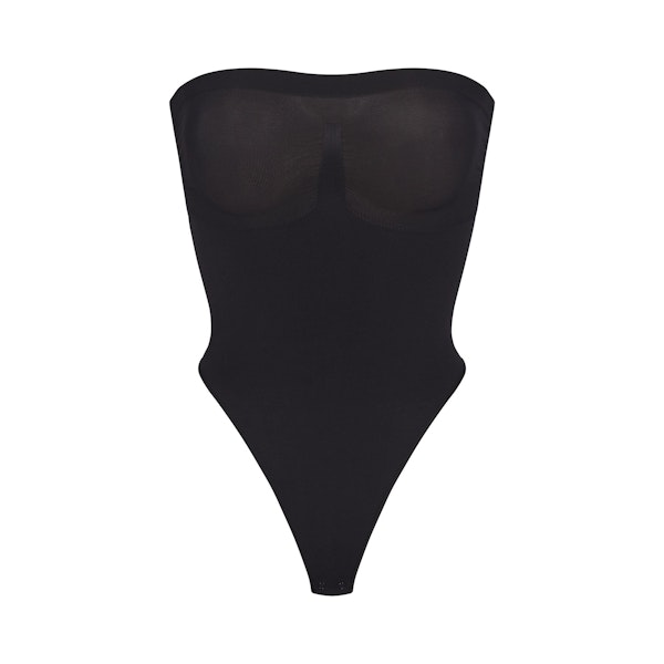 SEAMLESS SCULPT STRAPLESS THONG BODYSUIT | ONYX (SHAPEWEAR BODYSUITS) LAYS FLAT ON A WHITE BACKGROUND | FLT