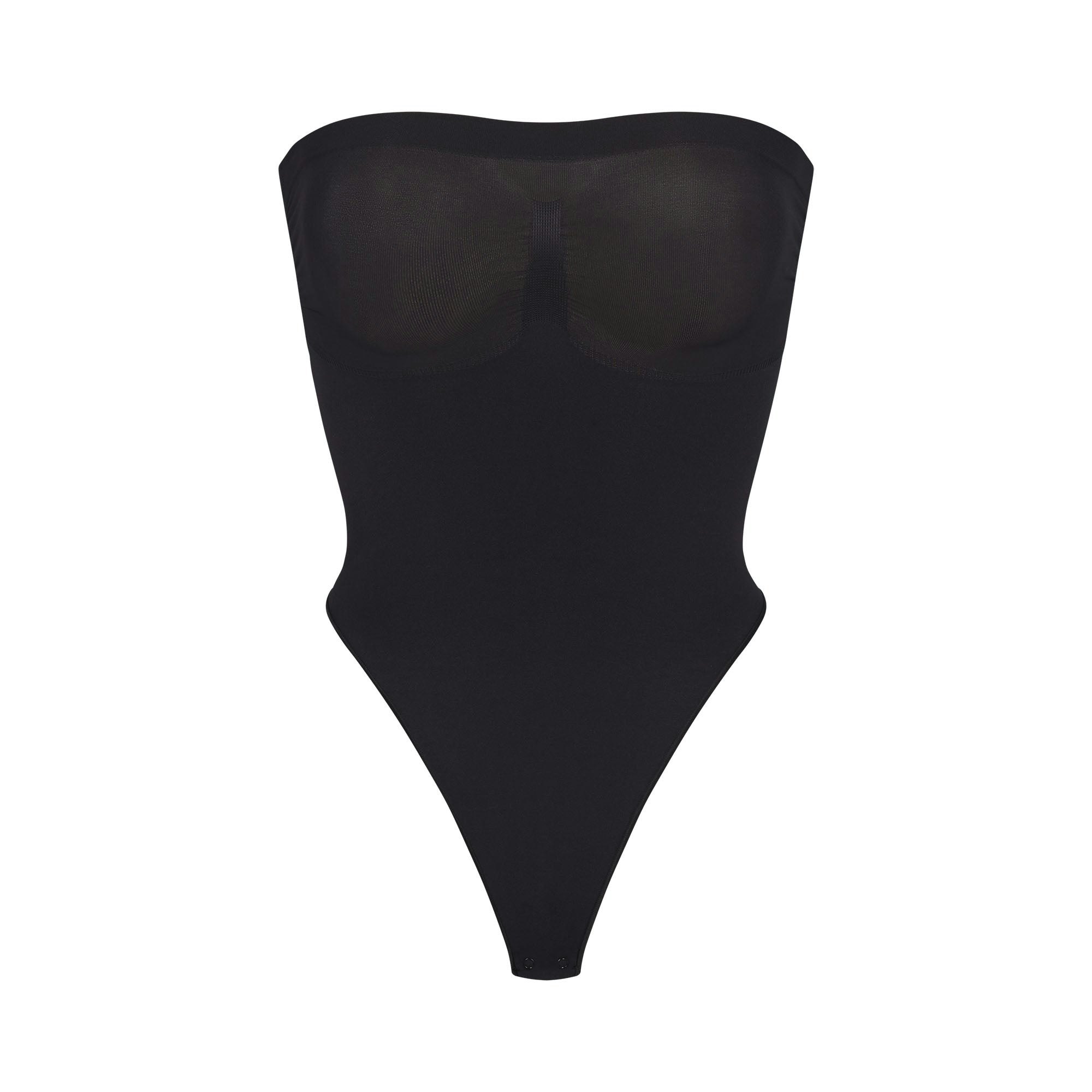 SEAMLESS SCULPT STRAPLESS THONG BODYSUIT | ONYX (SHAPEWEAR BODYSUITS) LAYS FLAT ON A WHITE BACKGROUND | FLT