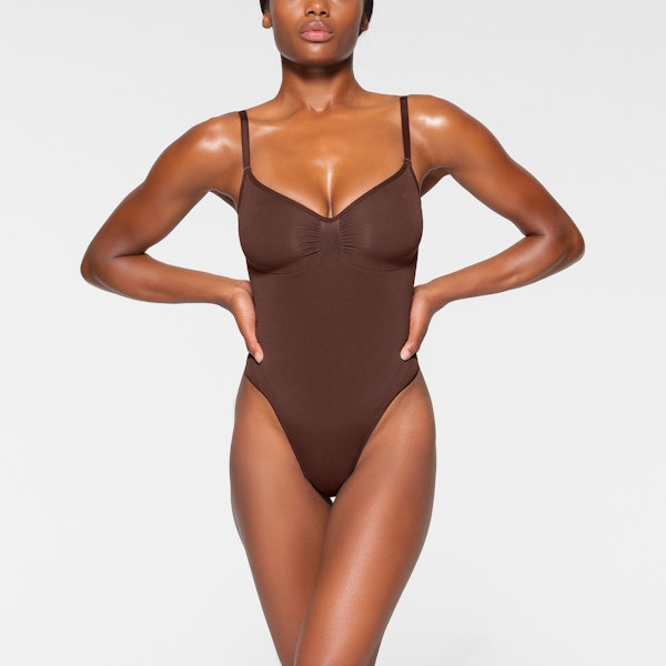 SEAMLESS SCULPT THONG BODYSUIT WORN BY A MODEL IN FRONT VIEW | SEE: XXS, XS, S