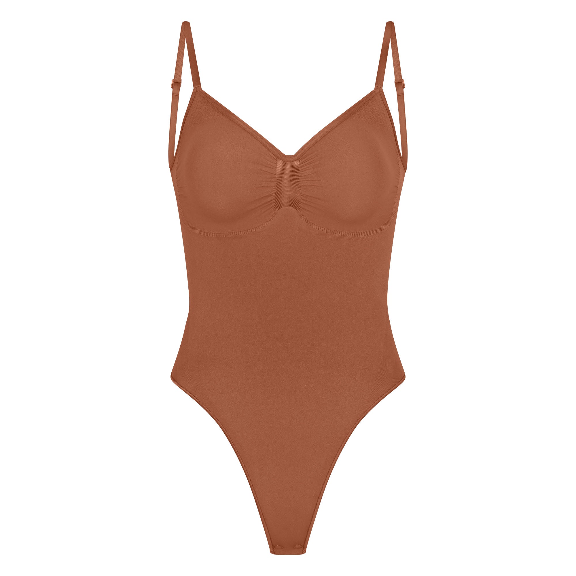 SEAMLESS SCULPT LOW BACK THONG BODYSUIT LAYS FLAT ON A WHITE BACKGROUND