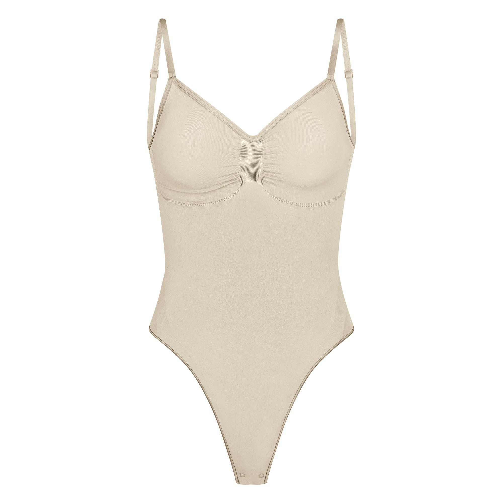 SEAMLESS SCULPT LOW BACK THONG BODYSUIT | SAND (LOW BACK SHAPEWEAR, BODYSUITS) LAYS FLAT ON A WHITE BACKGROUND | FLT
