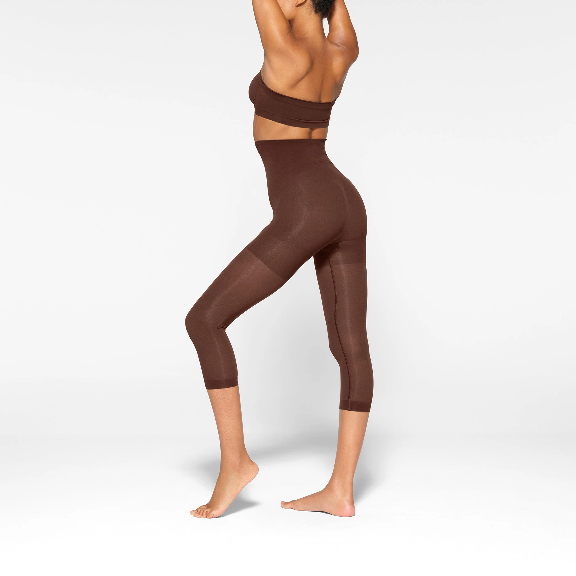 SEAMLESS SCULPT HIGH-WAISTED LEGGING WORN BY A MODEL IN SIDE VIEW