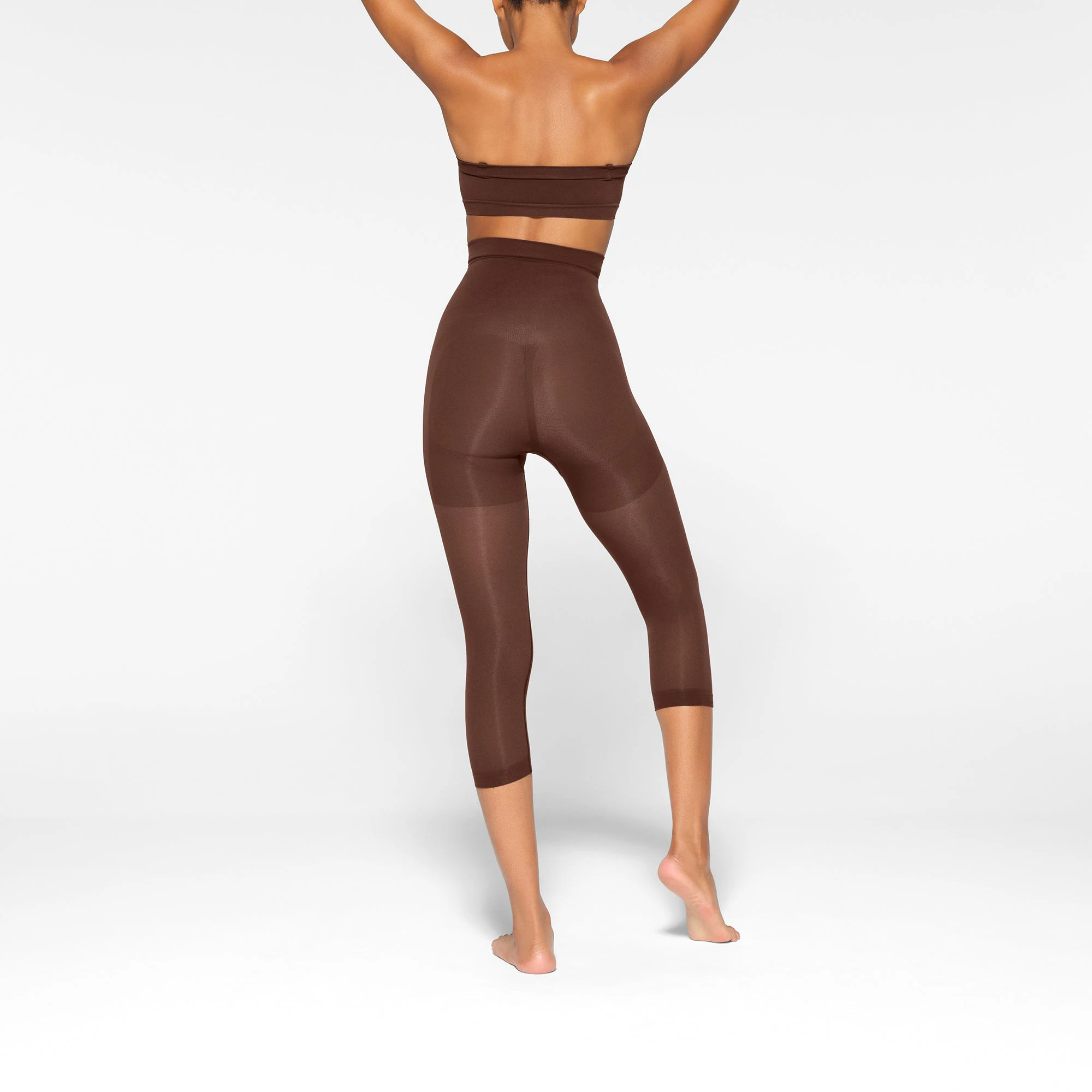 SEAMLESS SCULPT HIGH-WAISTED LEGGING WORN BY A MODEL IN BACK VIEW