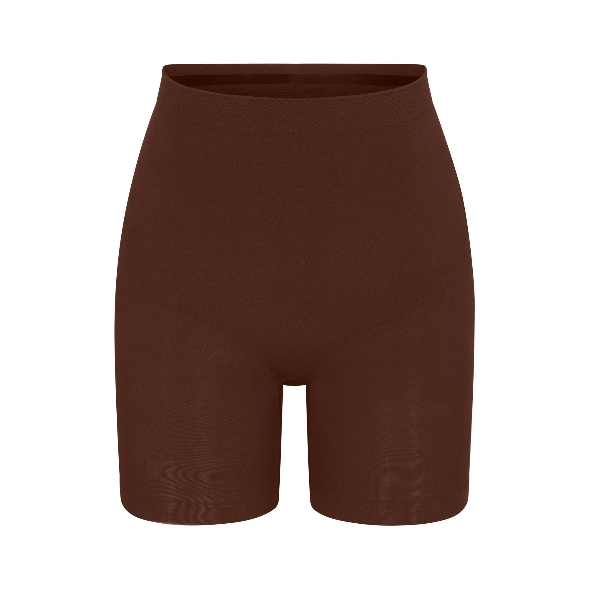 SEAMLESS SCULPT MID THIGH SHORT | COCOA (SHAPEWEAR SHORTS, SHAPEWEAR) LAYS FLAT ON A WHITE BACKGROUND | FLT