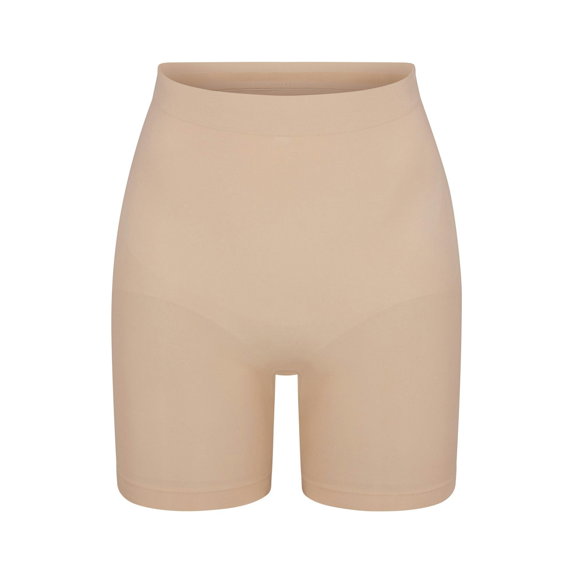 SEAMLESS SCULPT MID THIGH SHORT | MICA (SHAPEWEAR SHORTS, SHAPEWEAR) LAYS FLAT ON A WHITE BACKGROUND | FLT