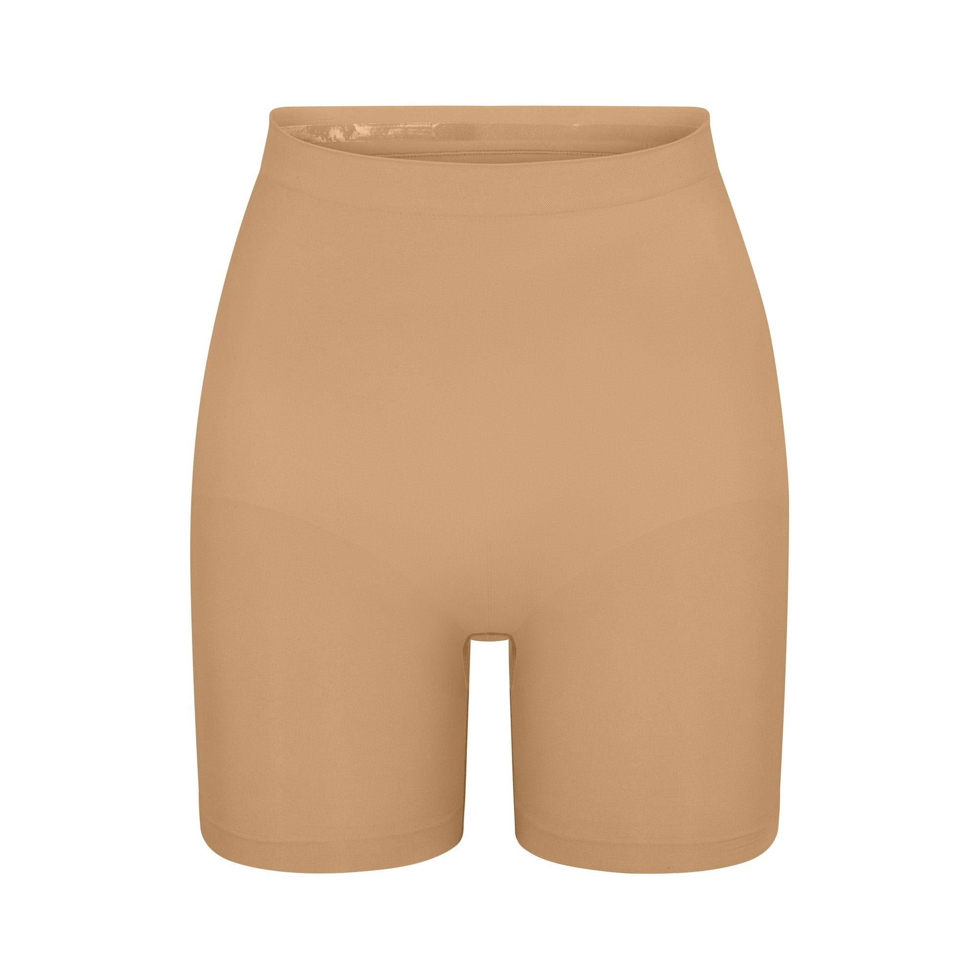 SEAMLESS SCULPT MID THIGH SHORT | OCHRE (SHAPEWEAR SHORTS, SHAPEWEAR) LAYS FLAT ON A WHITE BACKGROUND | FLT