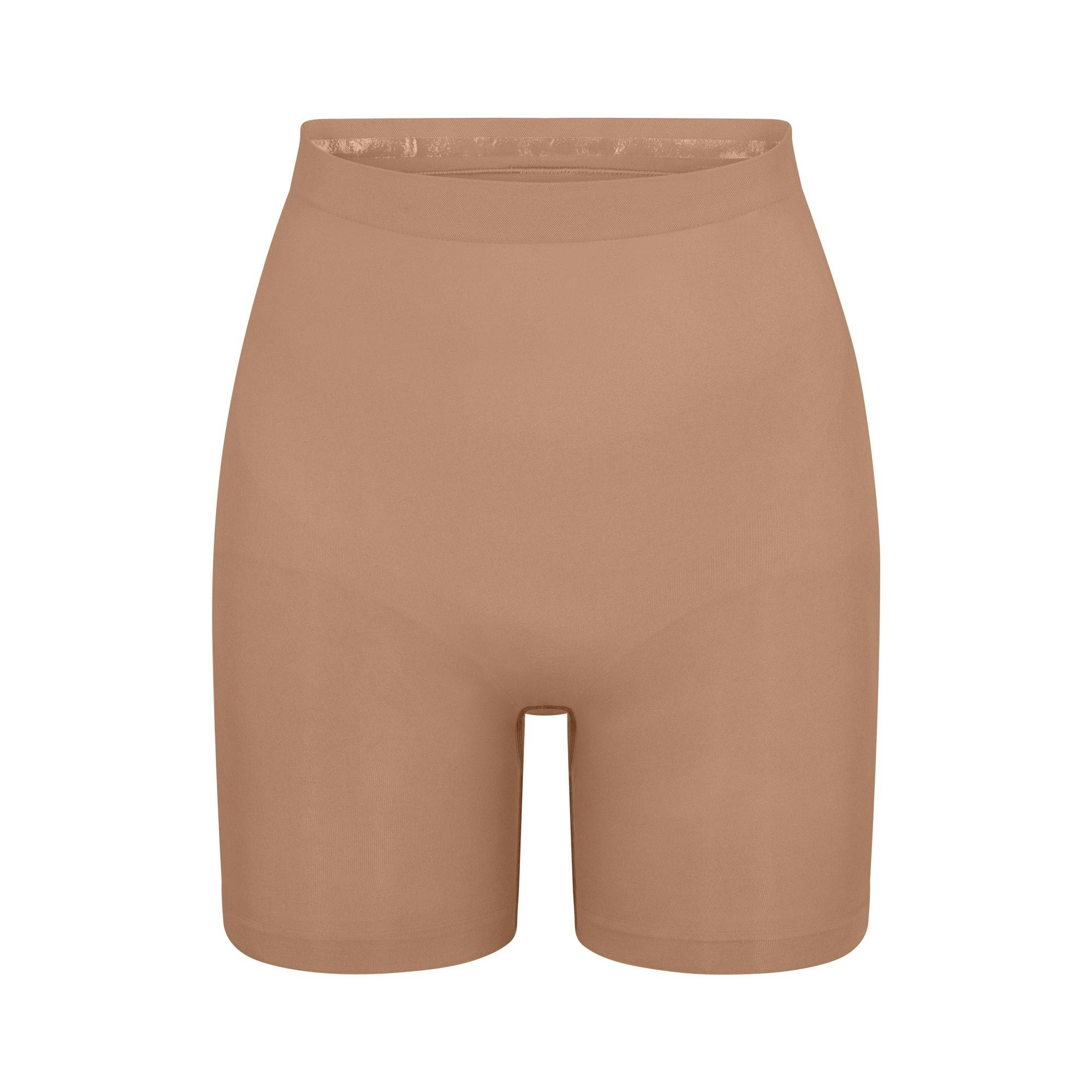 SEAMLESS SCULPT MID THIGH SHORT | SIENNA (SHAPEWEAR SHORTS, SHAPEWEAR) LAYS FLAT ON A WHITE BACKGROUND | FLT