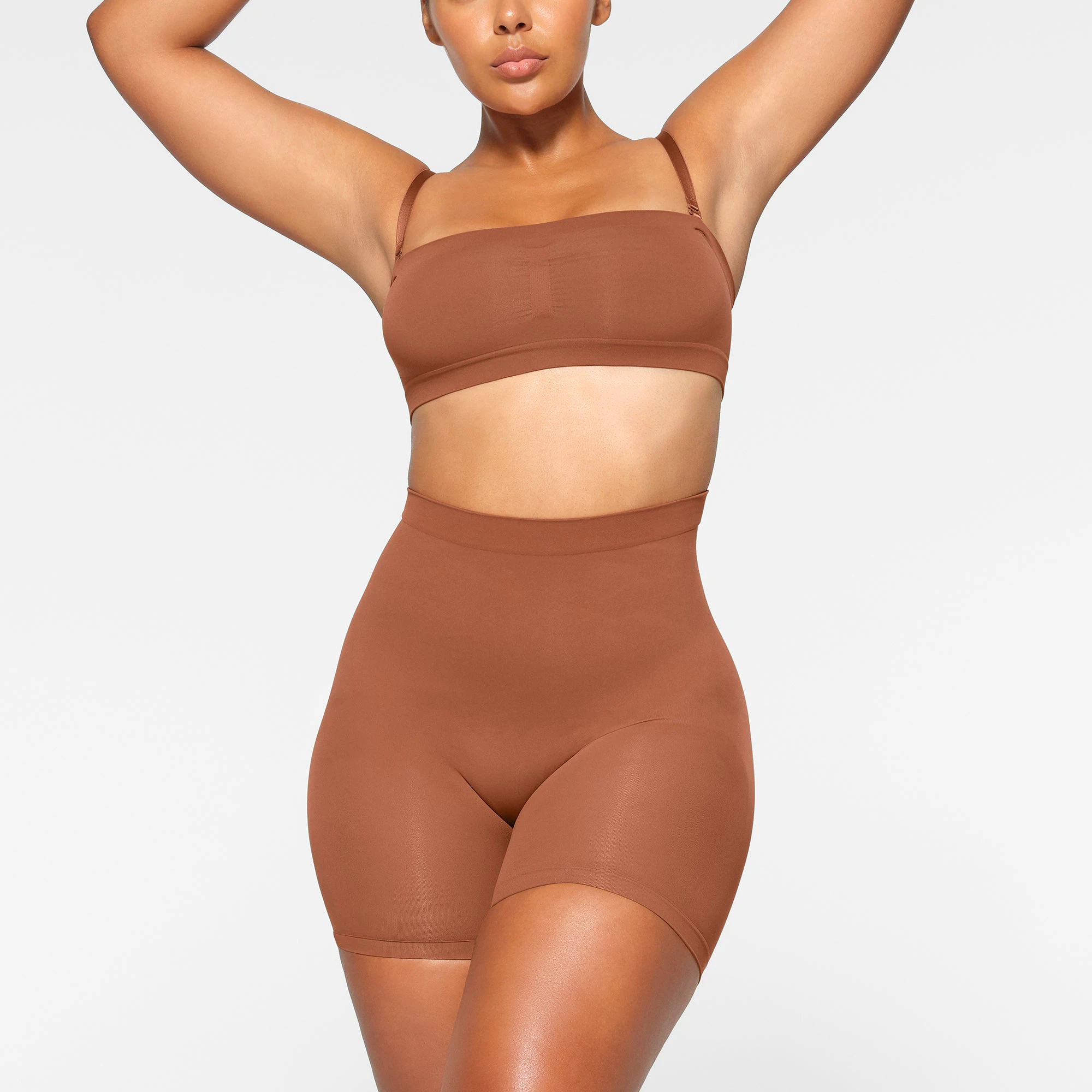SEAMLESS SCULPT BANDEAU WORN BY A MODEL IN FRONT VIEW