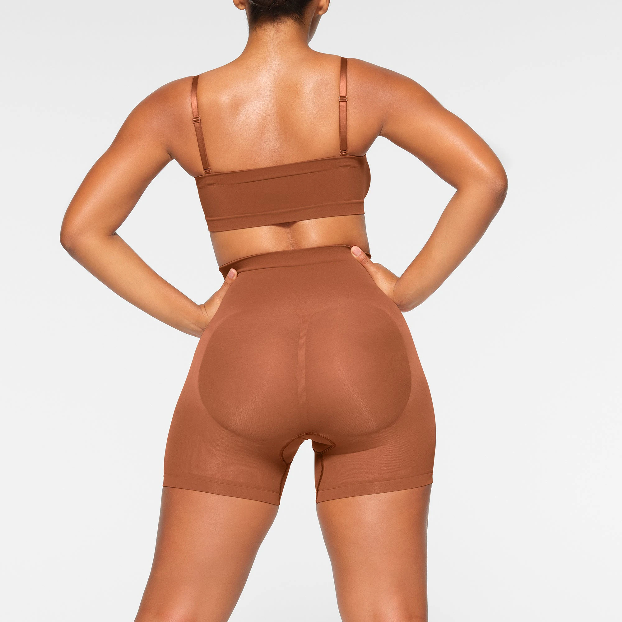 SEAMLESS SCULPT BANDEAU WORN BY A MODEL IN BACK VIEW