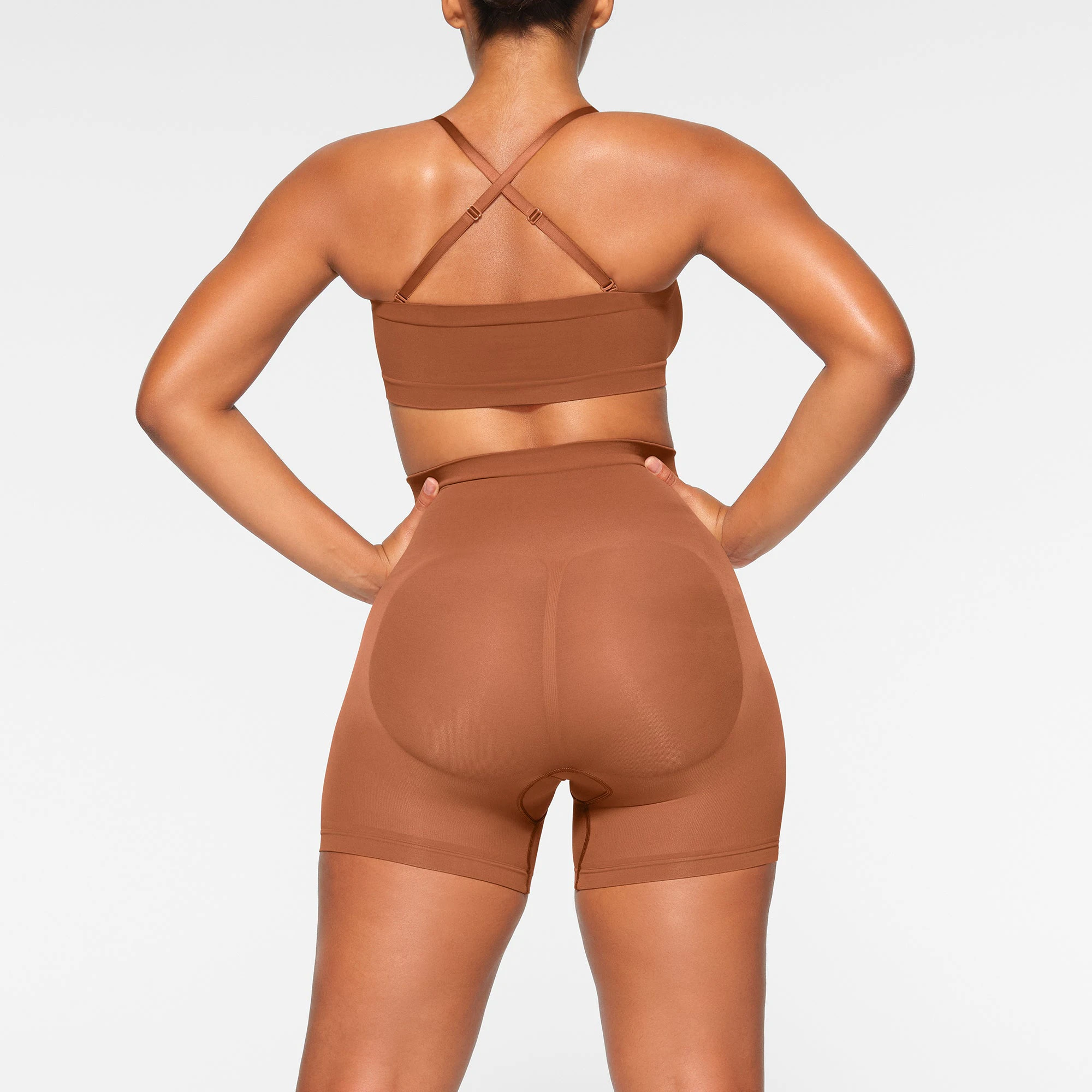 SEAMLESS SCULPT BANDEAU WORN BY A MODEL IN BACK VIEW