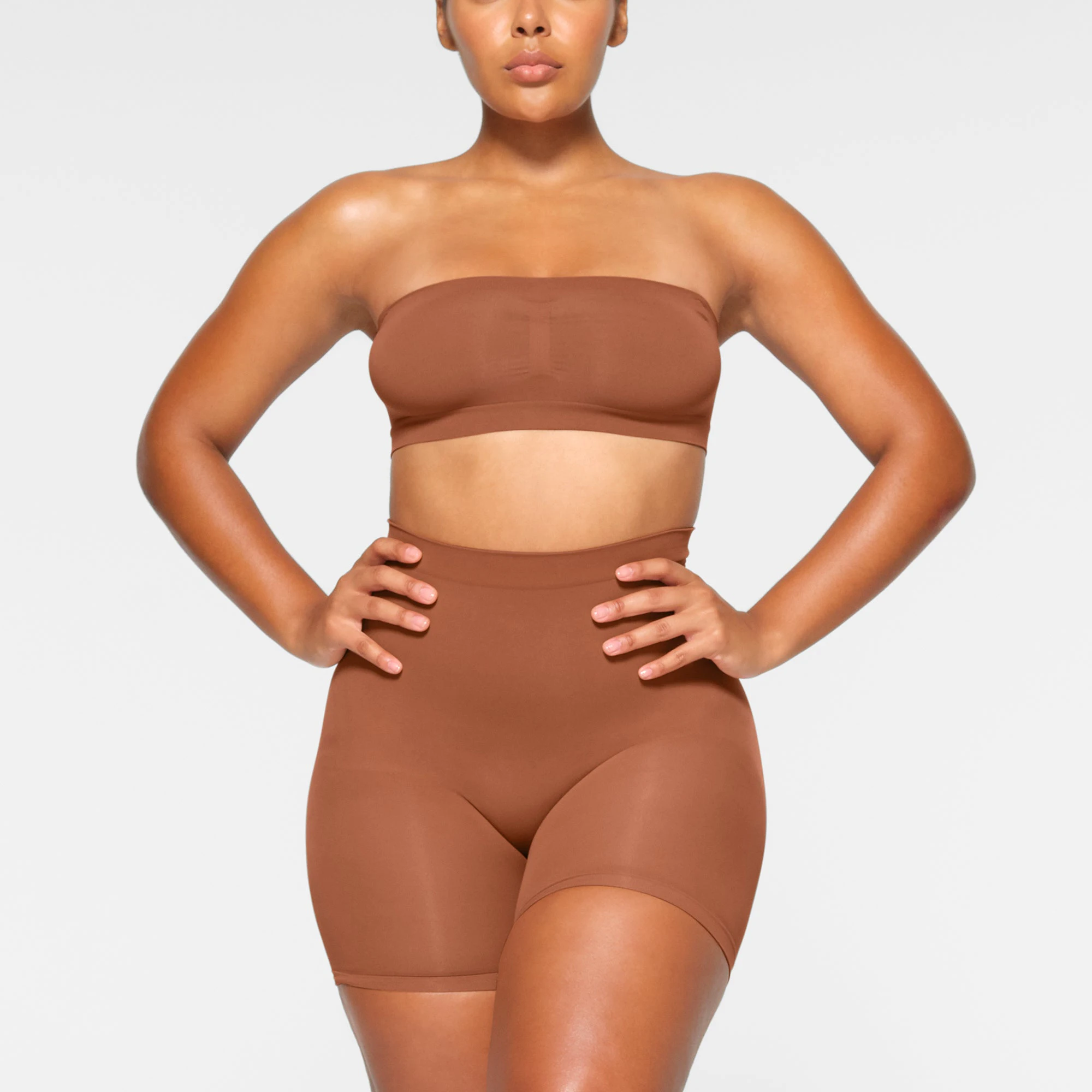 SEAMLESS SCULPT BANDEAU WORN BY A MODEL IN FRONT VIEW | SEE: M, L, XL