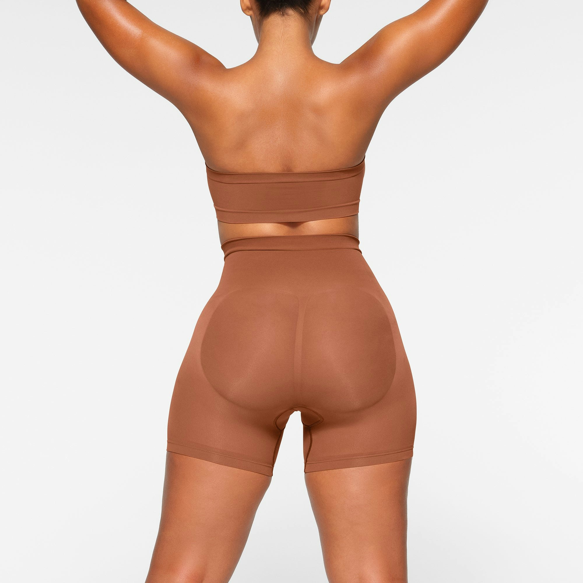 SEAMLESS SCULPT BANDEAU WORN BY A MODEL IN BACK VIEW