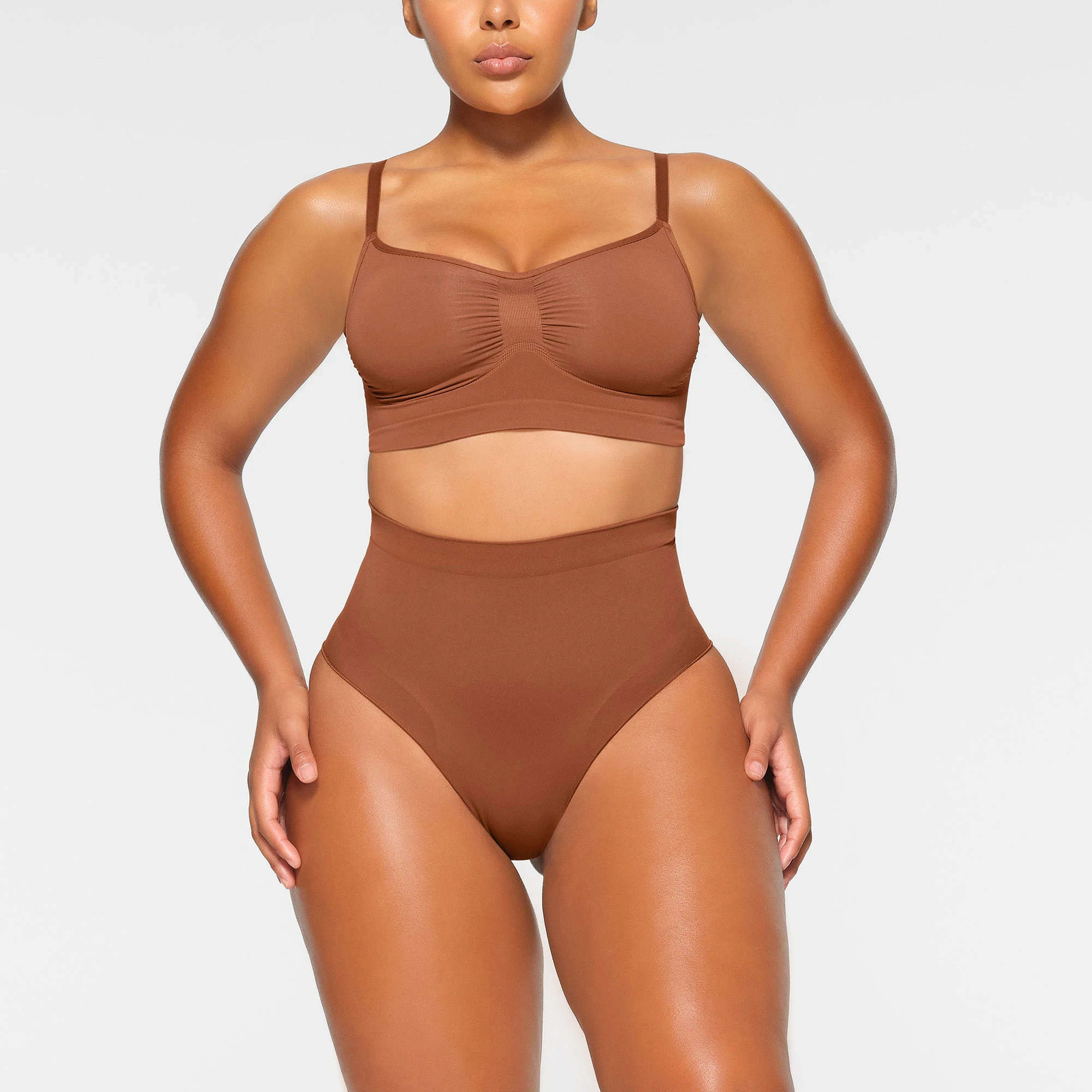 SEAMLESS SCULPT BRALETTE WORN BY A MODEL IN FRONT VIEW | SEE: M, L, XL
