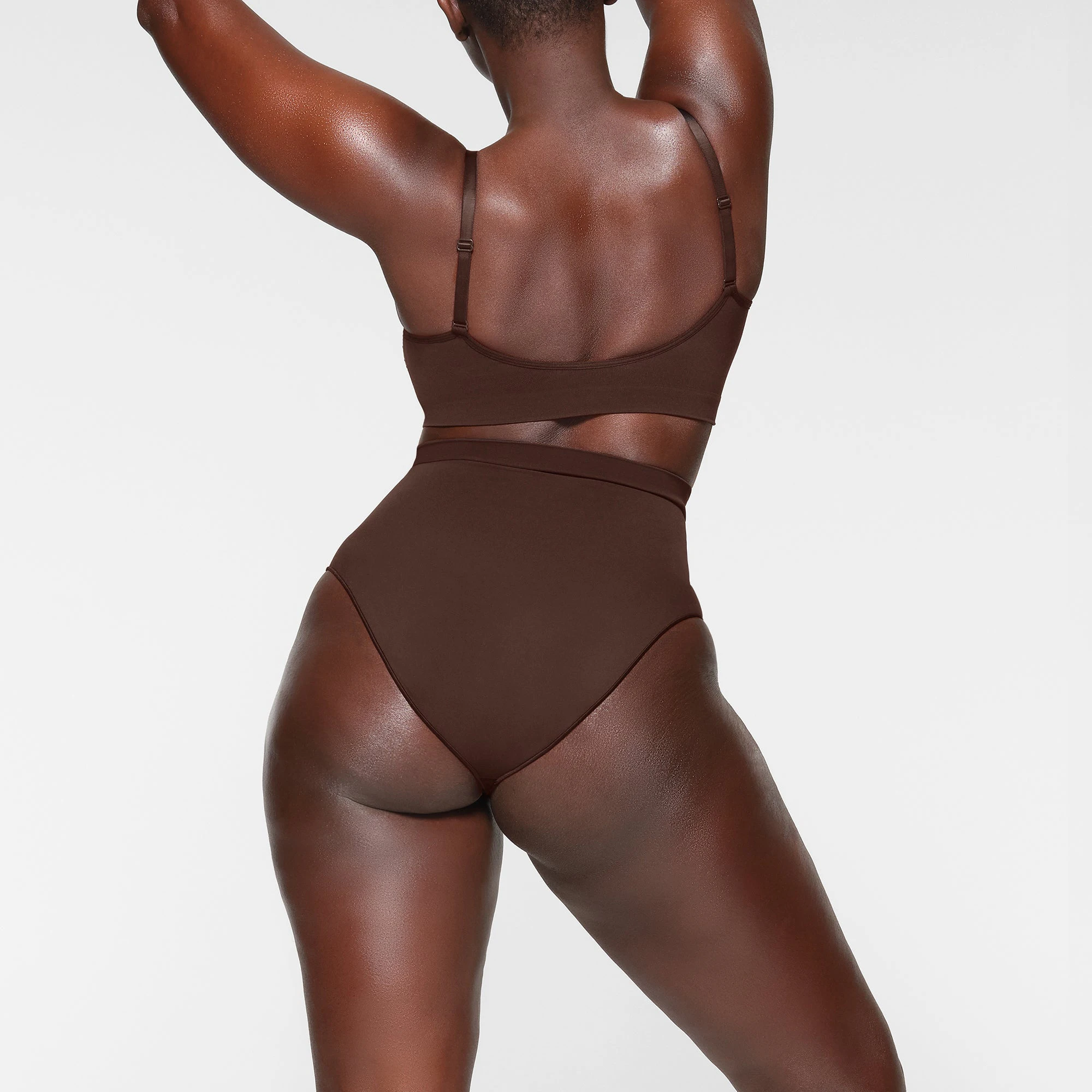 SEAMLESS SCULPT BRALETTE ON A MODEL BACK VIEW