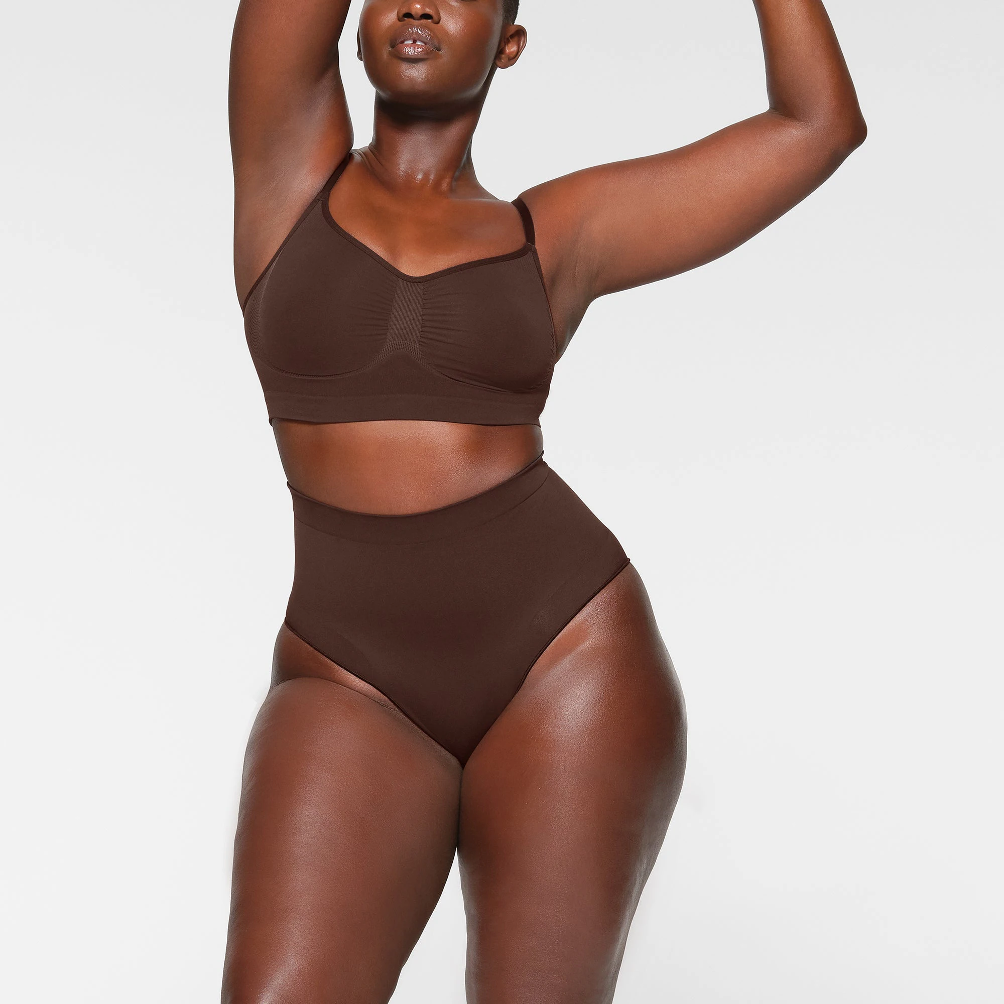 SEAMLESS SCULPT MID WAIST BRIEF WORN BY A MODEL IN FRONT VIEW | SEE: M, L, XL