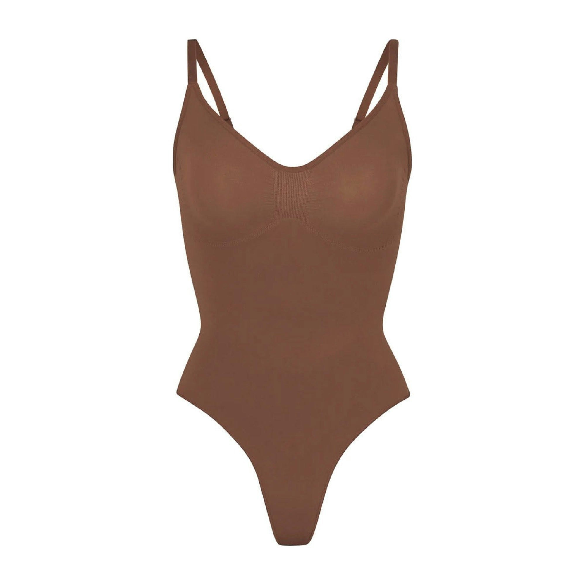 SEAMLESS SCULPT THONG BODYSUIT | JASPER (SHAPEWEAR BODYSUITS) LAYS FLAT ON A WHITE BACKGROUND | FLT