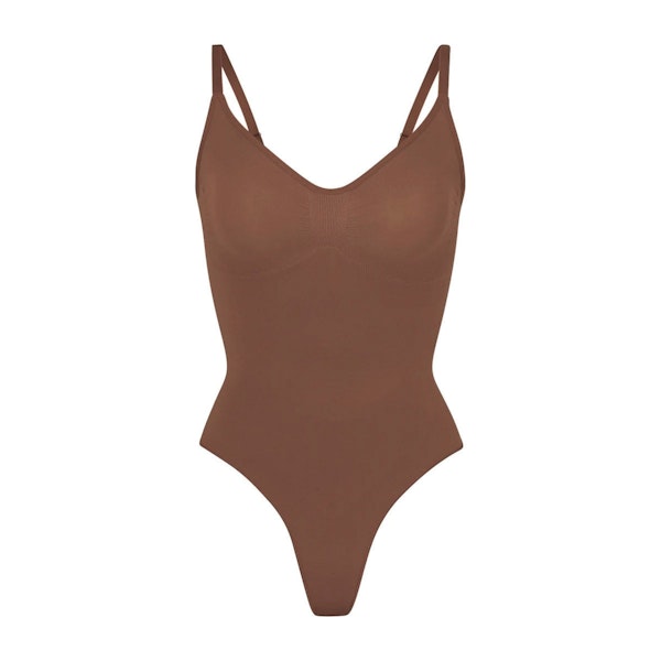 SEAMLESS SCULPT THONG BODYSUIT | JASPER (SHAPEWEAR BODYSUITS) LAYS FLAT ON A WHITE BACKGROUND | FLT