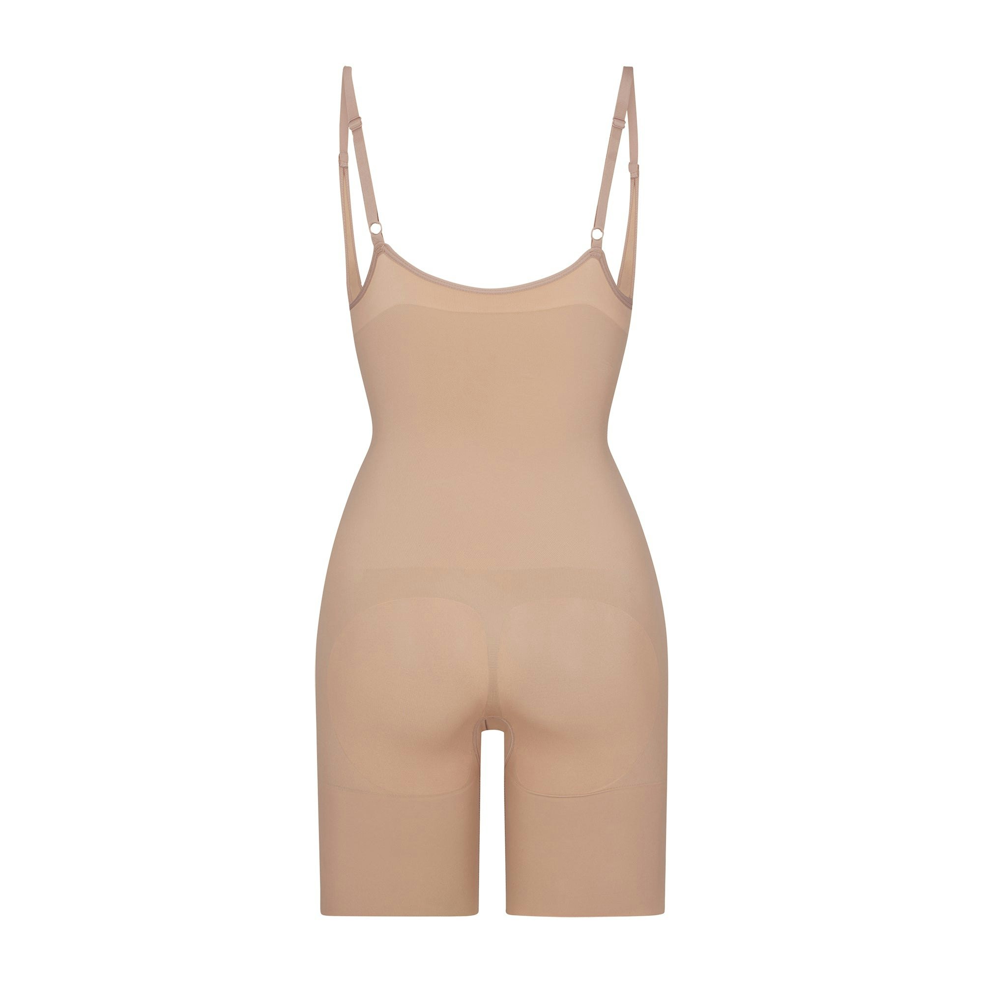 BUTT ENHANCING OPEN BUST BODYSUIT LAYS FLAT ON A WHITE BACKGROUND | FLT