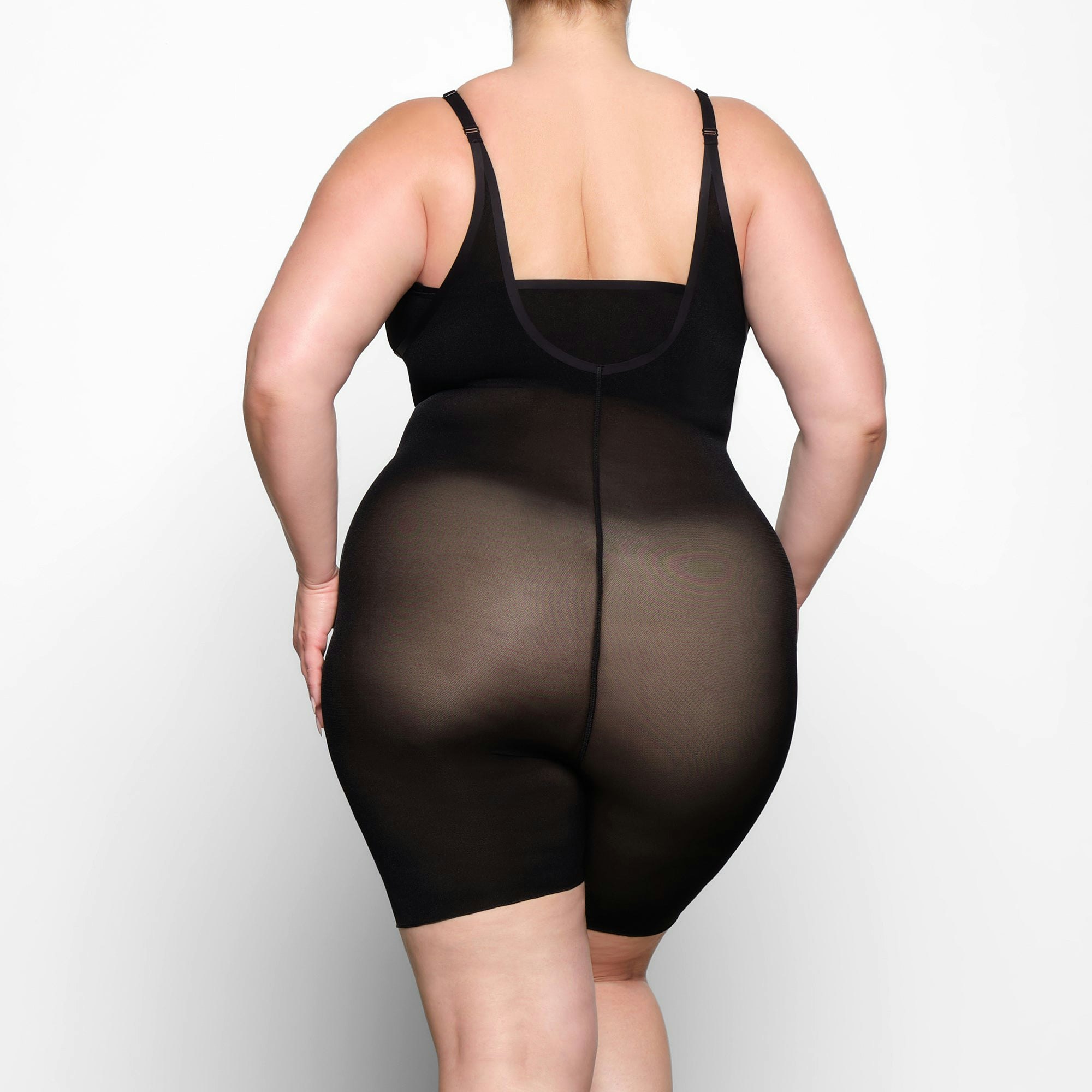 SHEER SCULPT OPEN BUST BODYSUIT ON A MODEL BACK VIEW