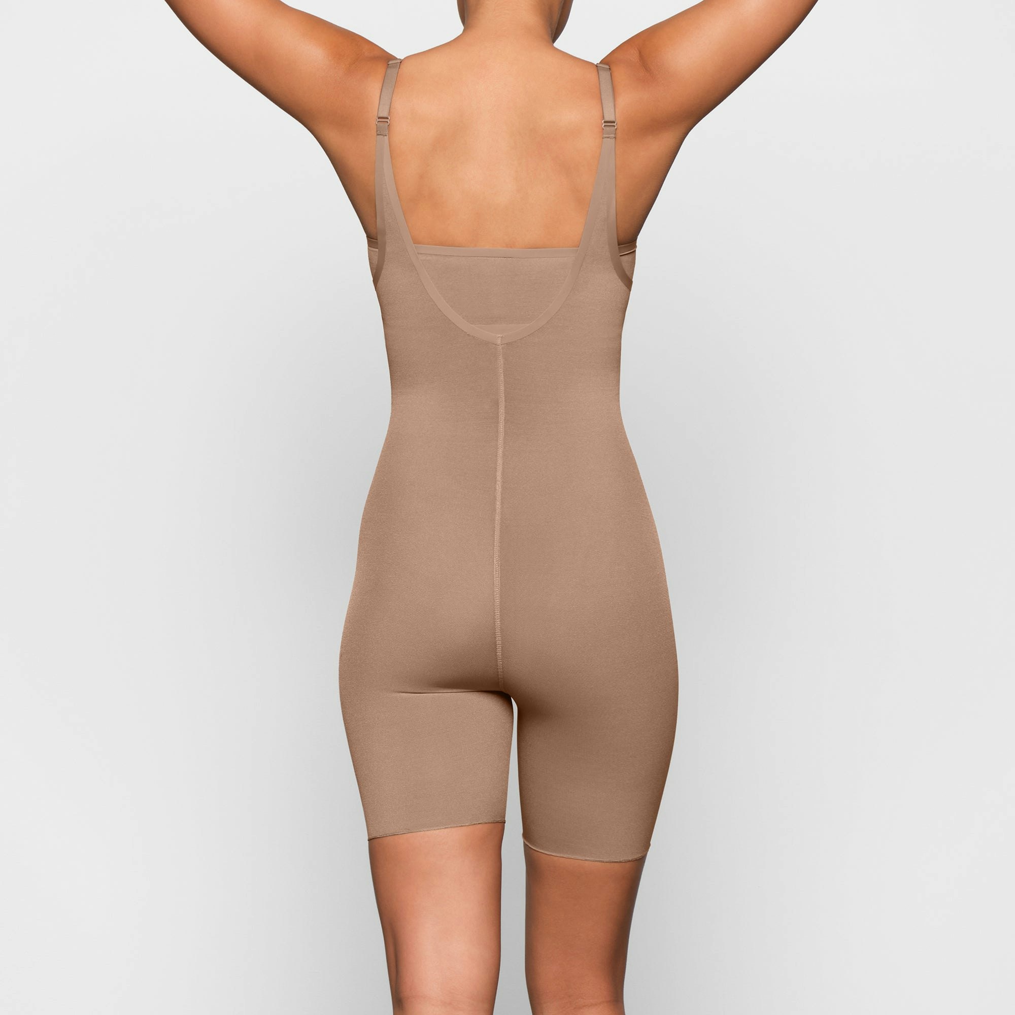 SHEER SCULPT OPEN BUST BODYSUIT ON A MODEL BACK VIEW