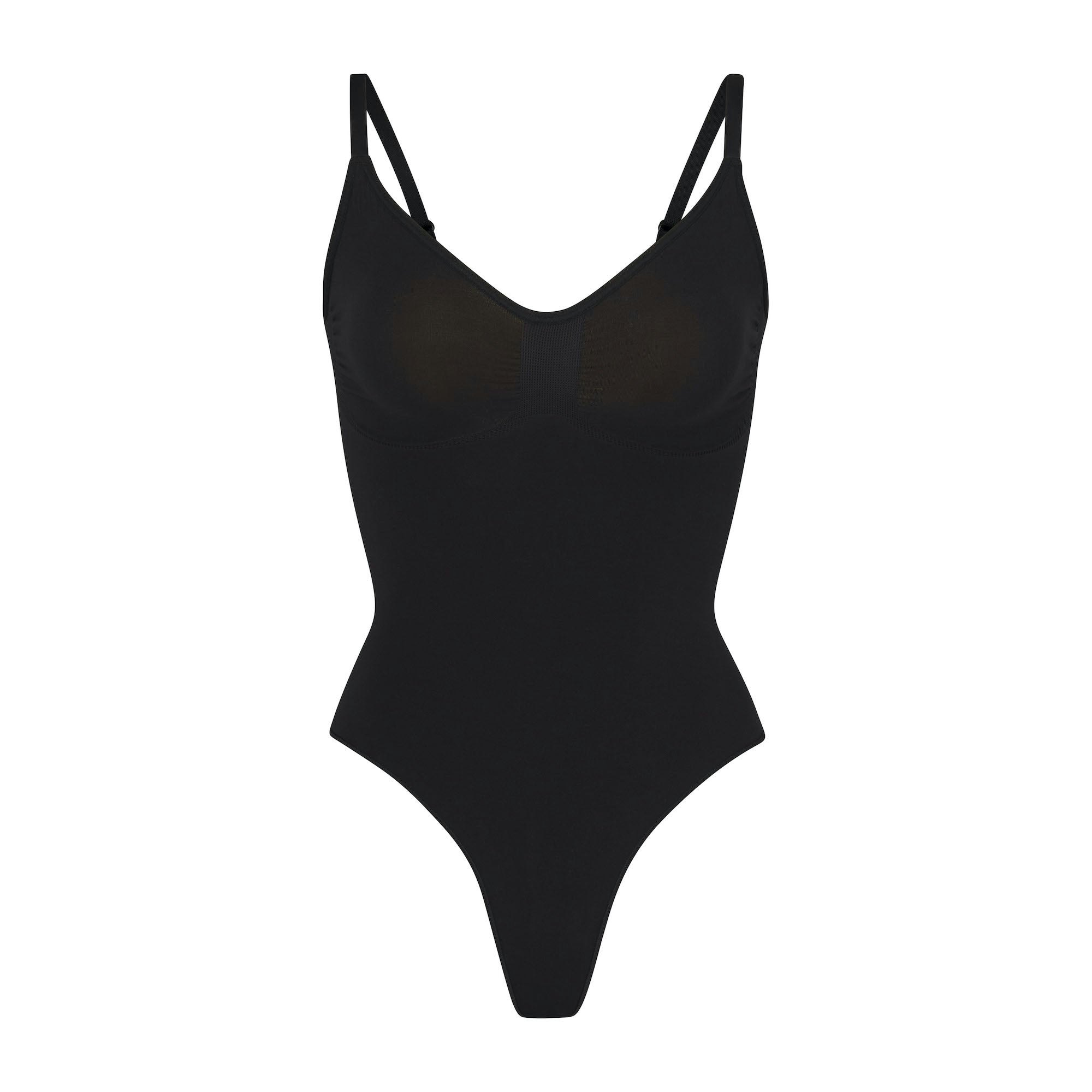 SEAMLESS SCULPT THONG BODYSUIT | ONYX (SHAPEWEAR BODYSUITS) LAYS FLAT ON A WHITE BACKGROUND | FLT
