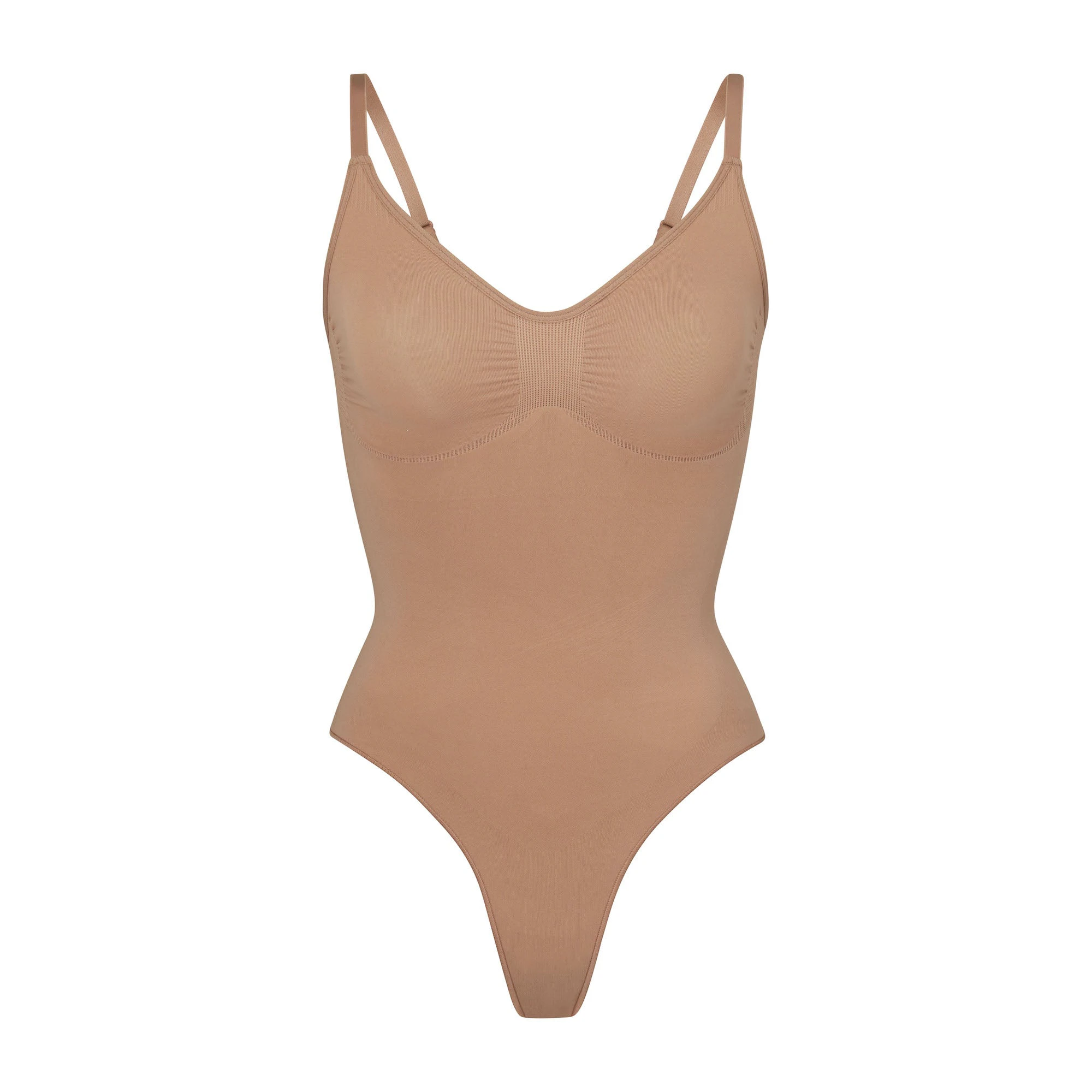 SEAMLESS SCULPT THONG BODYSUIT | SIENNA (SHAPEWEAR BODYSUITS) LAYS FLAT ON A WHITE BACKGROUND | FLT