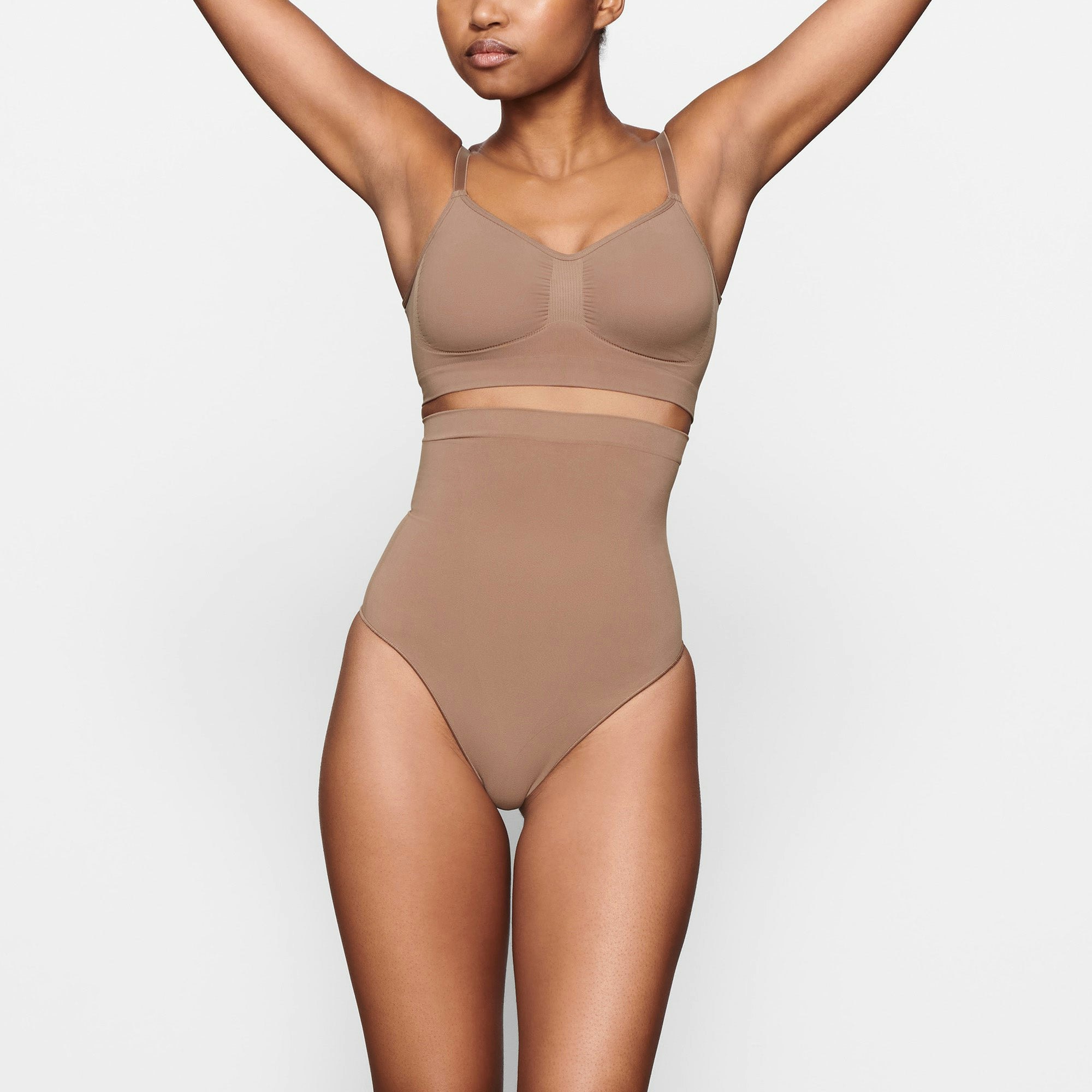 SEAMLESS SCULPT HIGH-WAISTED THONG WORN BY A MODEL IN FRONT VIEW | SEE: XXS, XS, S