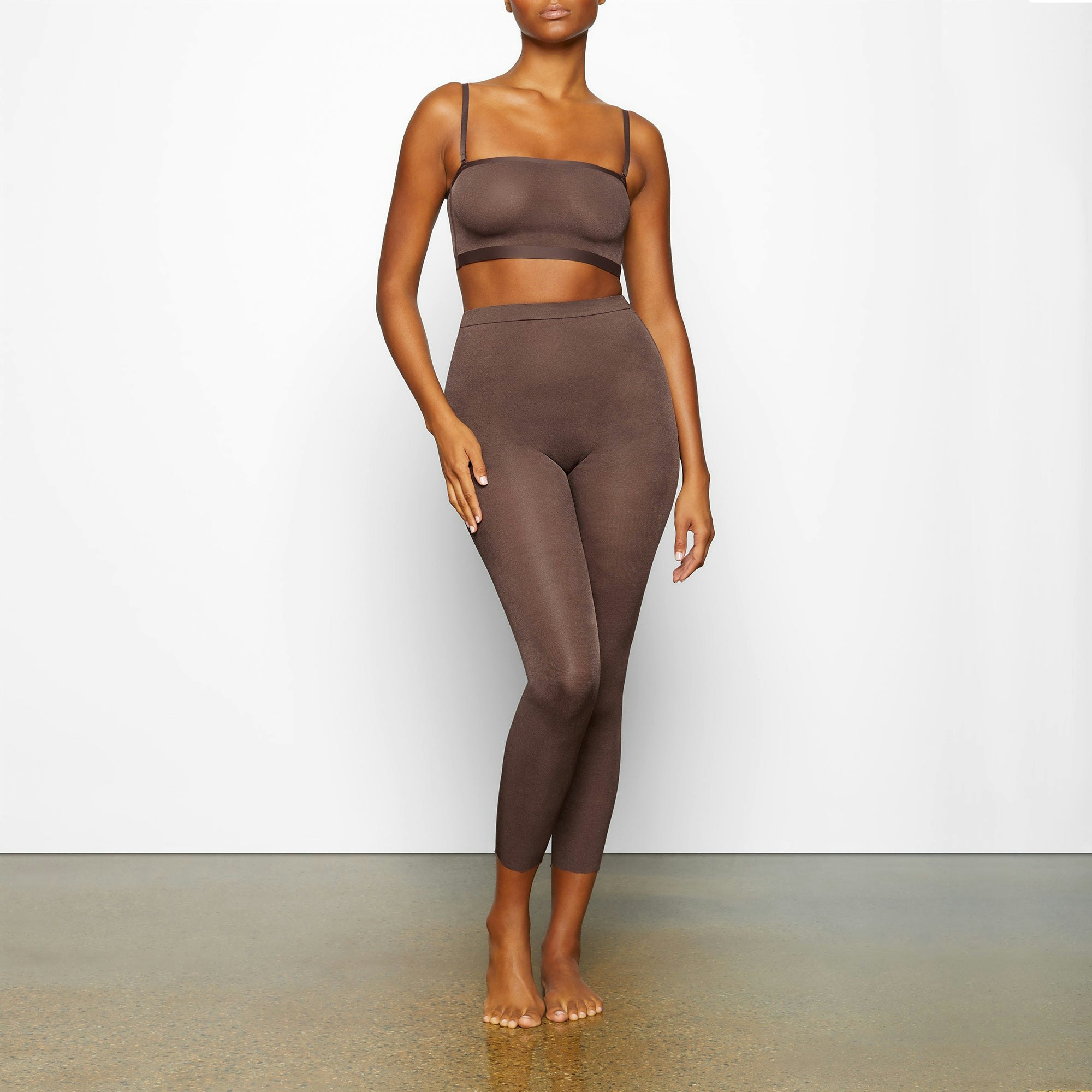 SHEER SCULPT LOW BACK LEGGING WORN BY A MODEL IN FRONT VIEW | SEE: M, L, XL