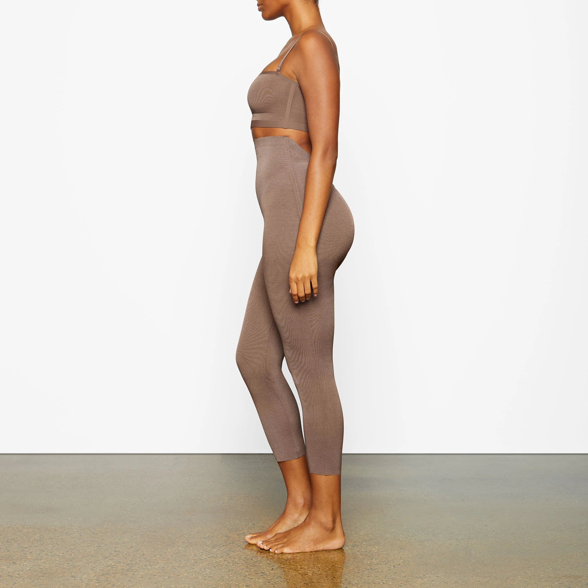 SHEER SCULPT LOW BACK LEGGING WORN BY A MODEL IN SIDE VIEW