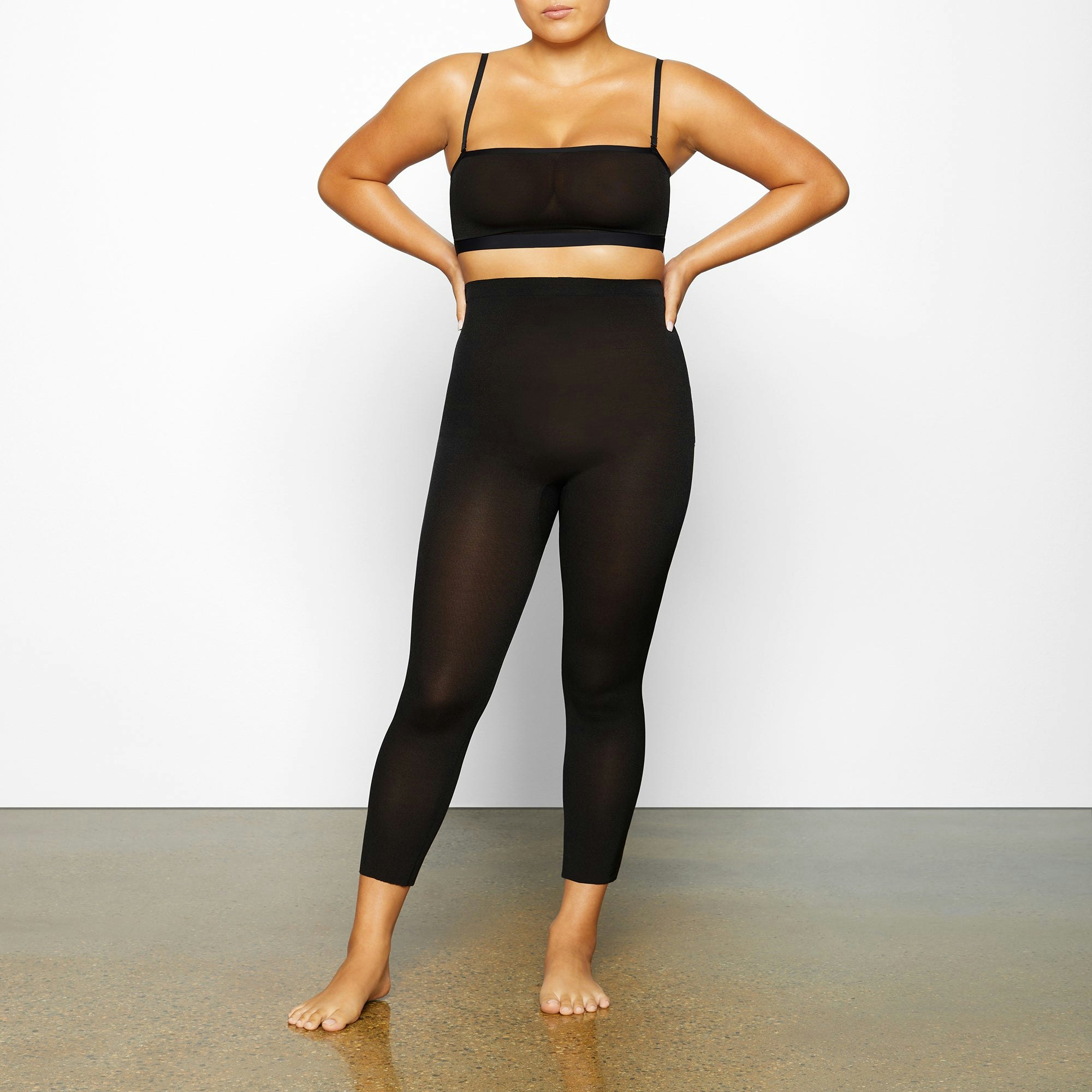 SHEER SCULPT LOW BACK LEGGING WORN BY A MODEL IN FRONT VIEW | SEE: M, L, XL