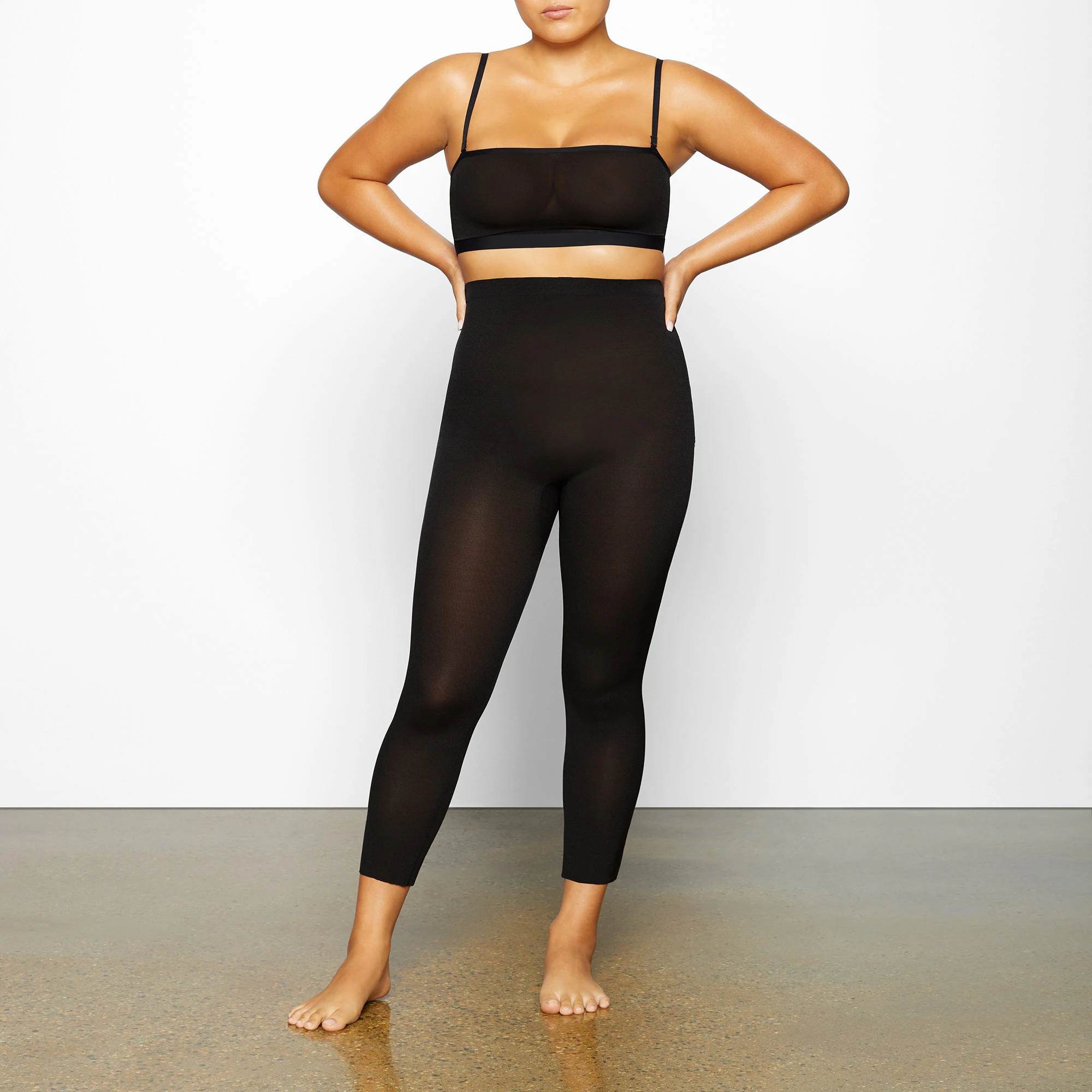 SHEER SCULPT LOW BACK LEGGING WORN BY A MODEL IN FRONT VIEW | SEE: M, L, XL