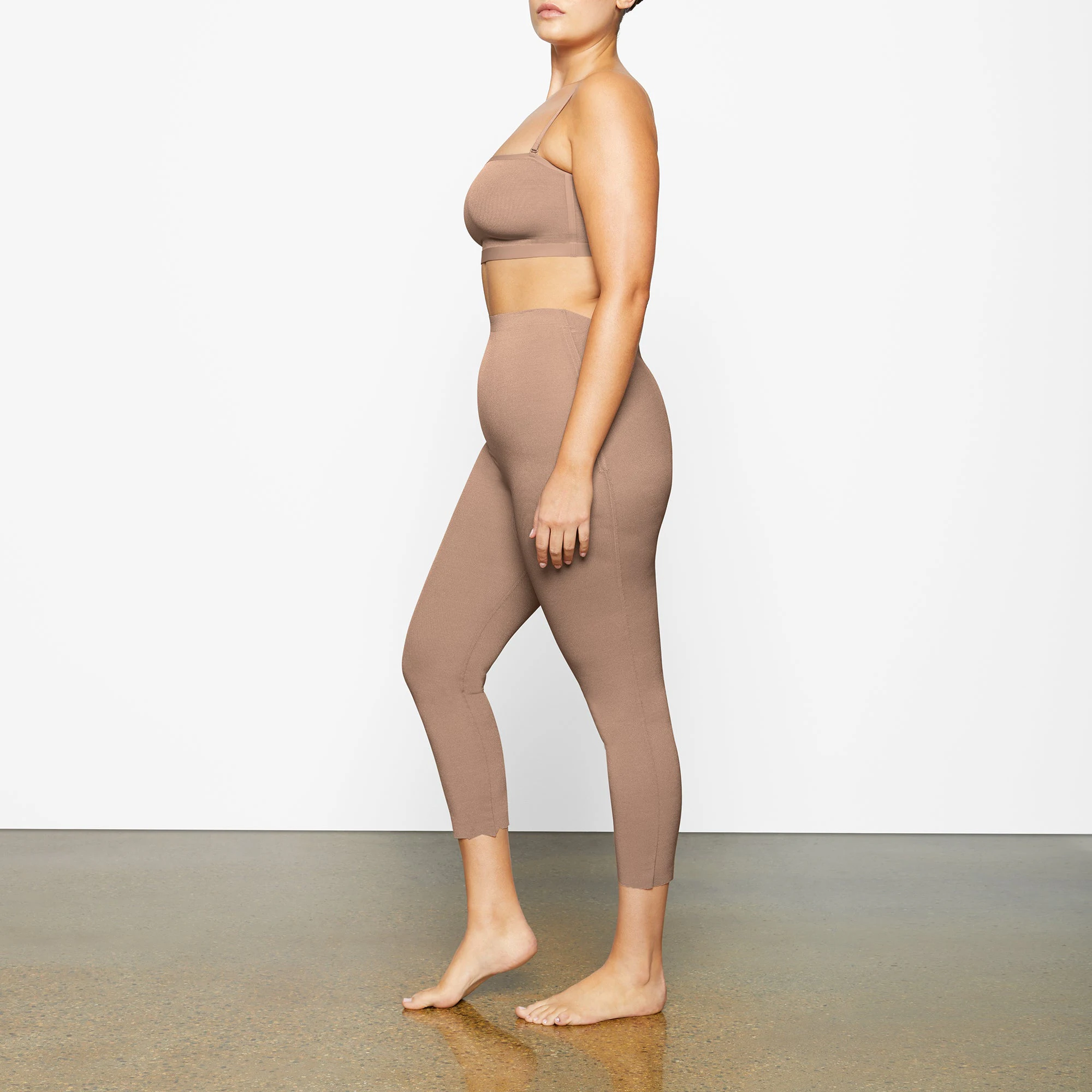 SHEER SCULPT LOW BACK LEGGING WORN BY A MODEL IN SIDE VIEW