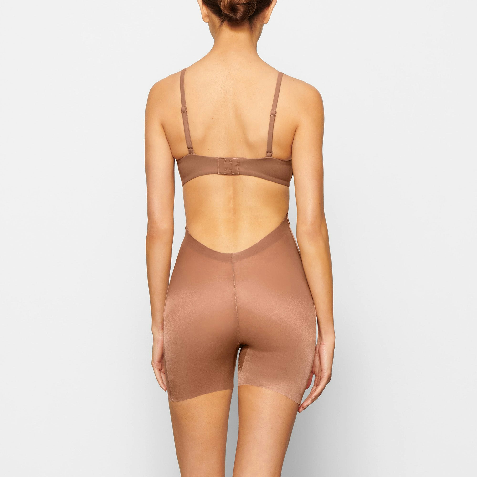 BARELY THERE LOW BACK SHORT WORN BY A MODEL IN BACK VIEW