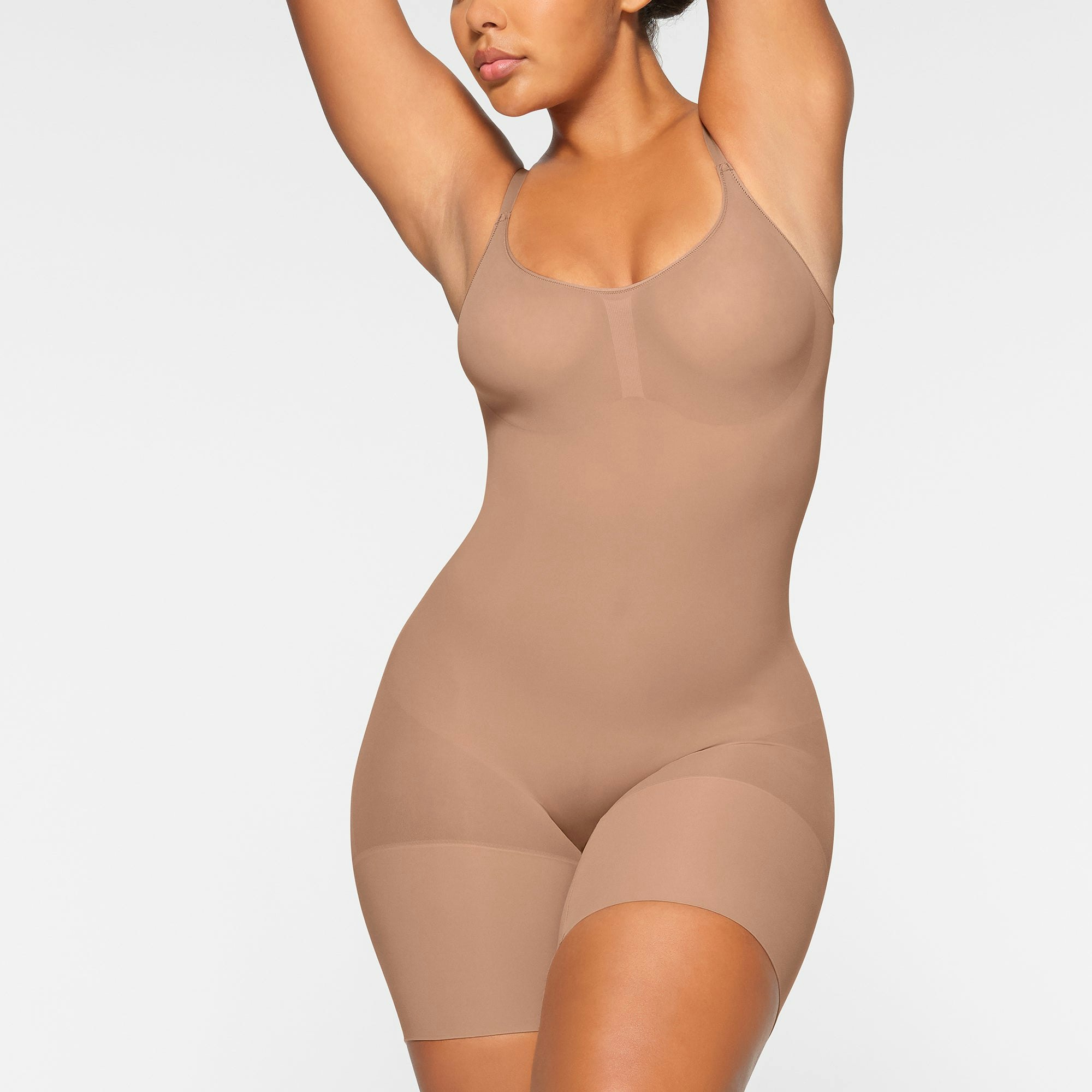 EVERYDAY SCULPT MID THIGH BODYSUIT WORN BY A MODEL IN FRONT VIEW | SEE: M, L, XL