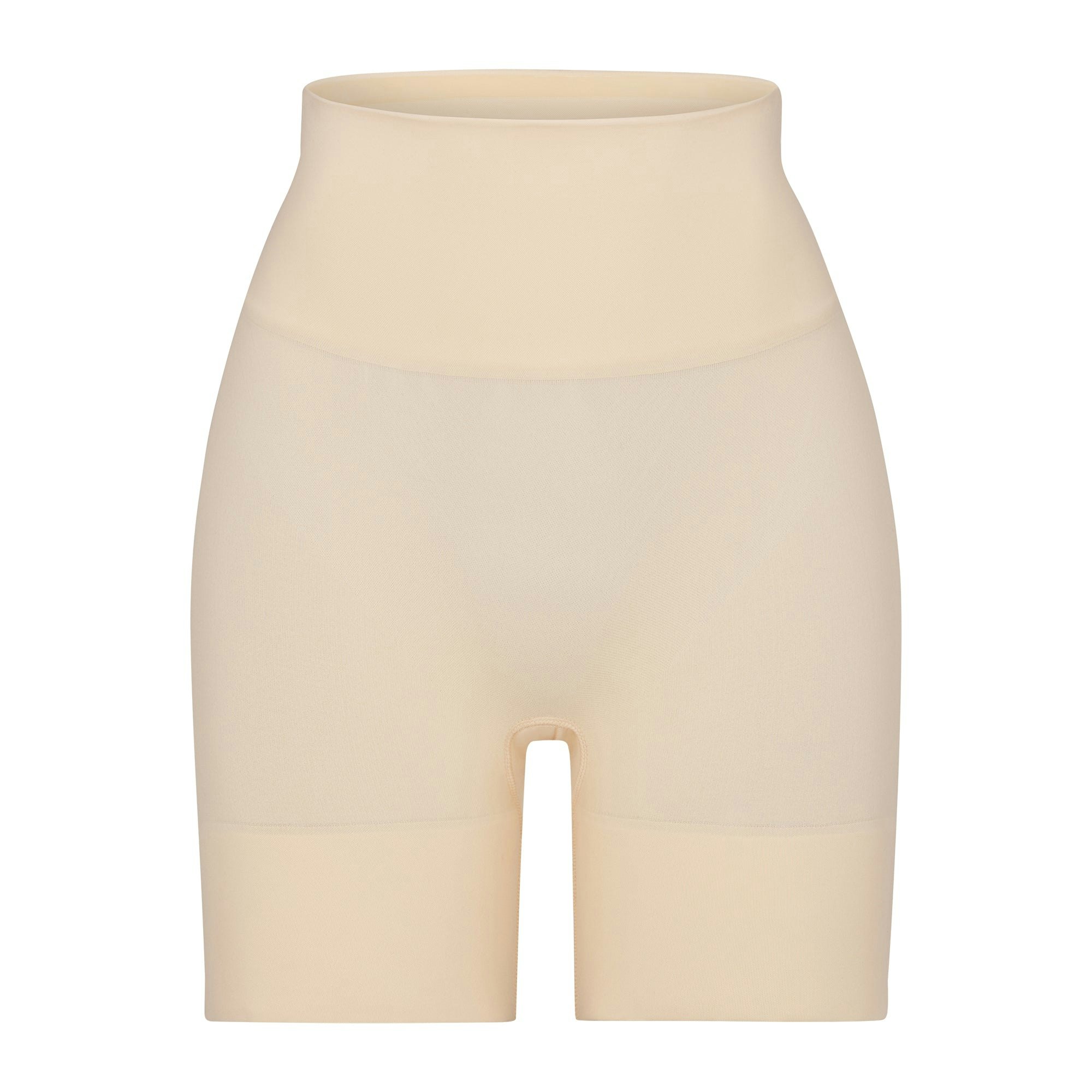 BUTT ENHANCING SHORT | SAND (SHAPEWEAR SHORTS, SHAPEWEAR) LAYS FLAT ON A WHITE BACKGROUND | FLT