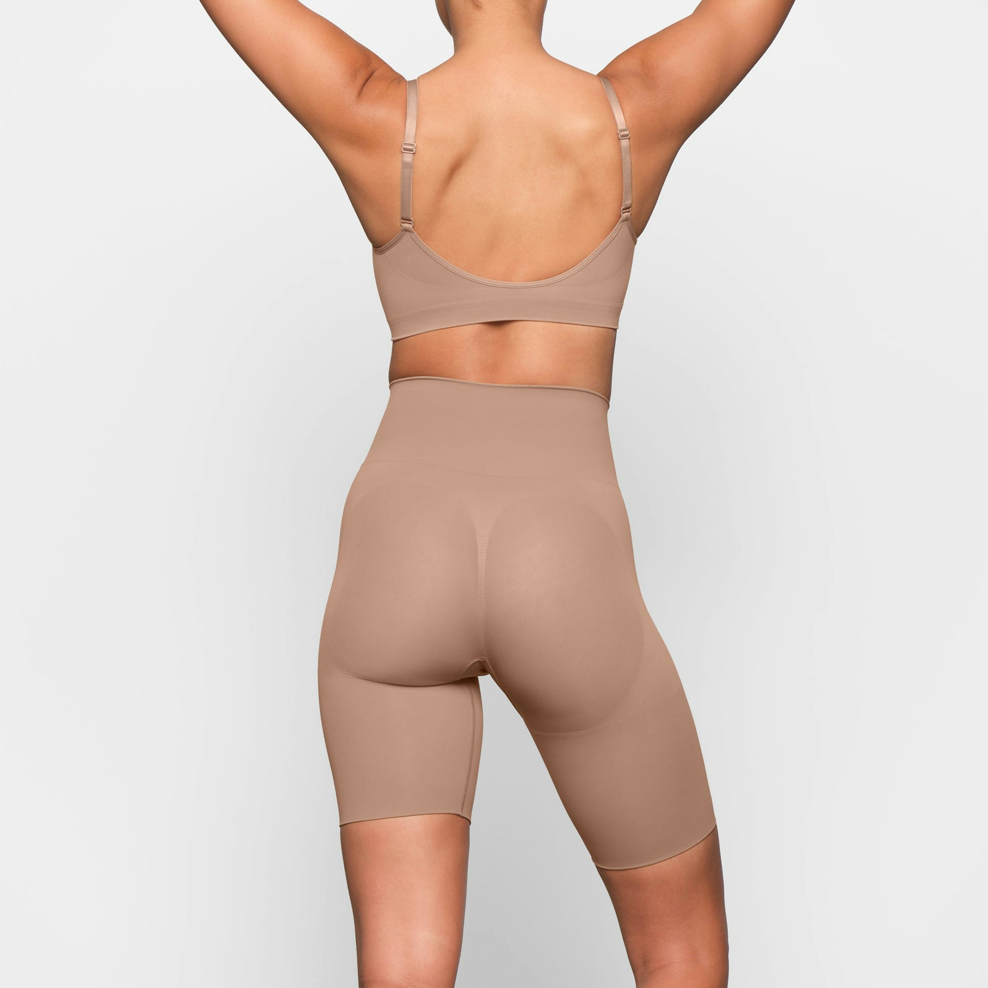 BUTT ENHANCING SHORT ON A MODEL BACK VIEW