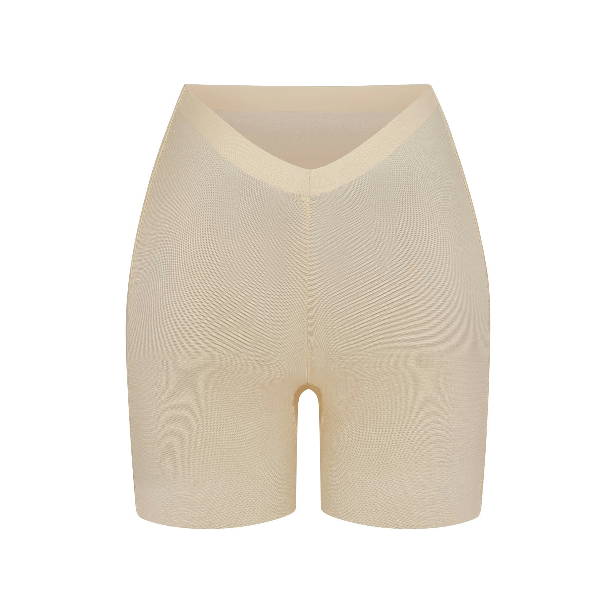 SHEER SCULPT LOW BACK SHORT LAYS FLAT ON A WHITE BACKGROUND | FLT