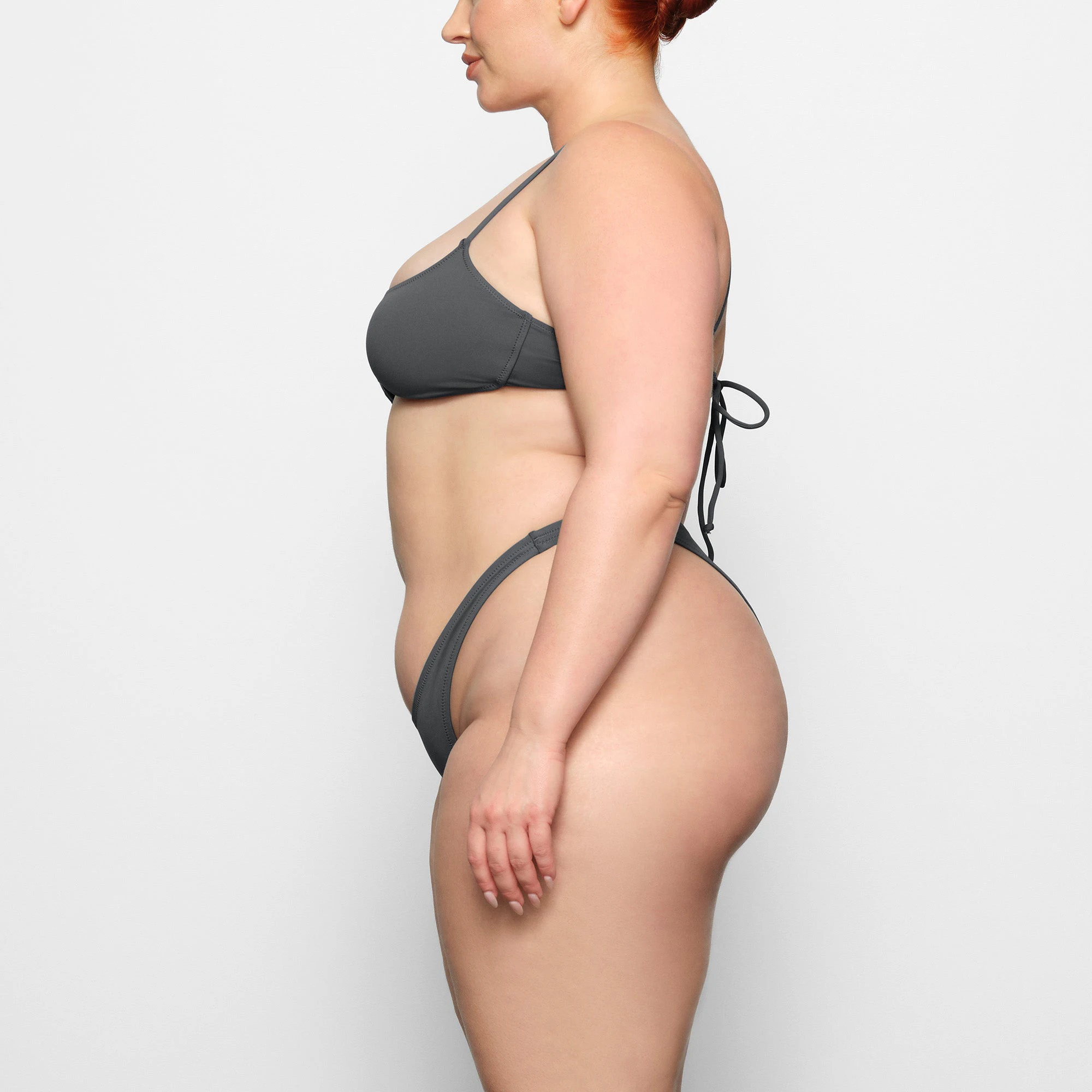 SWIM MICRO SCOOP BIKINI TOP WORN BY A MODEL IN SIDE VIEW