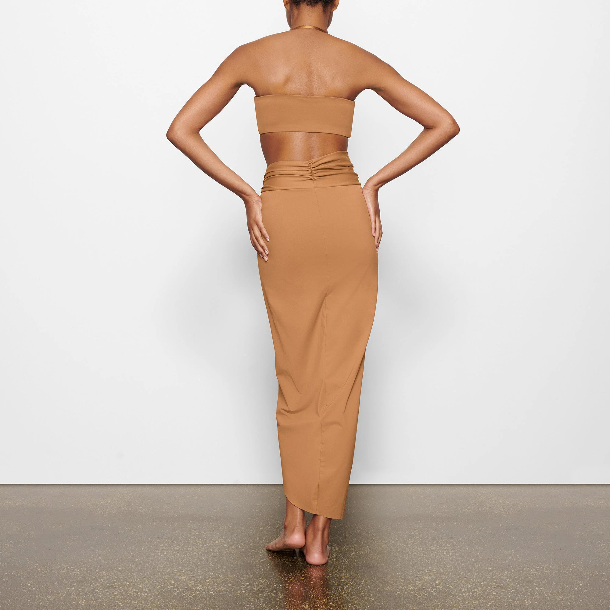 SWIM BANDEAU BIKINI TOP WORN BY A MODEL IN BACK VIEW