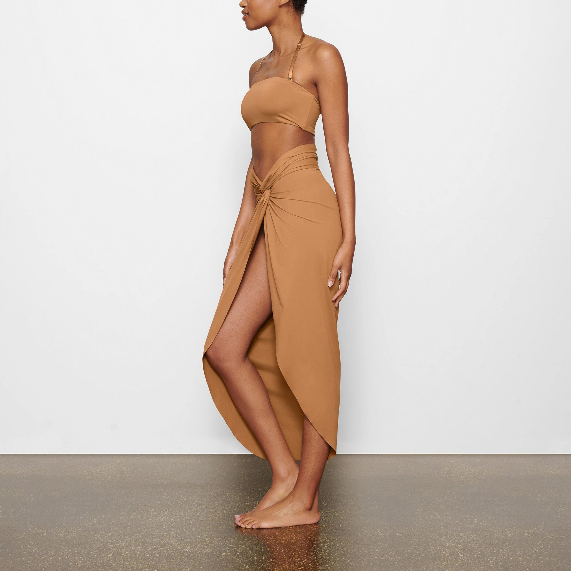 SWIM BANDEAU BIKINI TOP WORN BY A MODEL IN FRONT VIEW