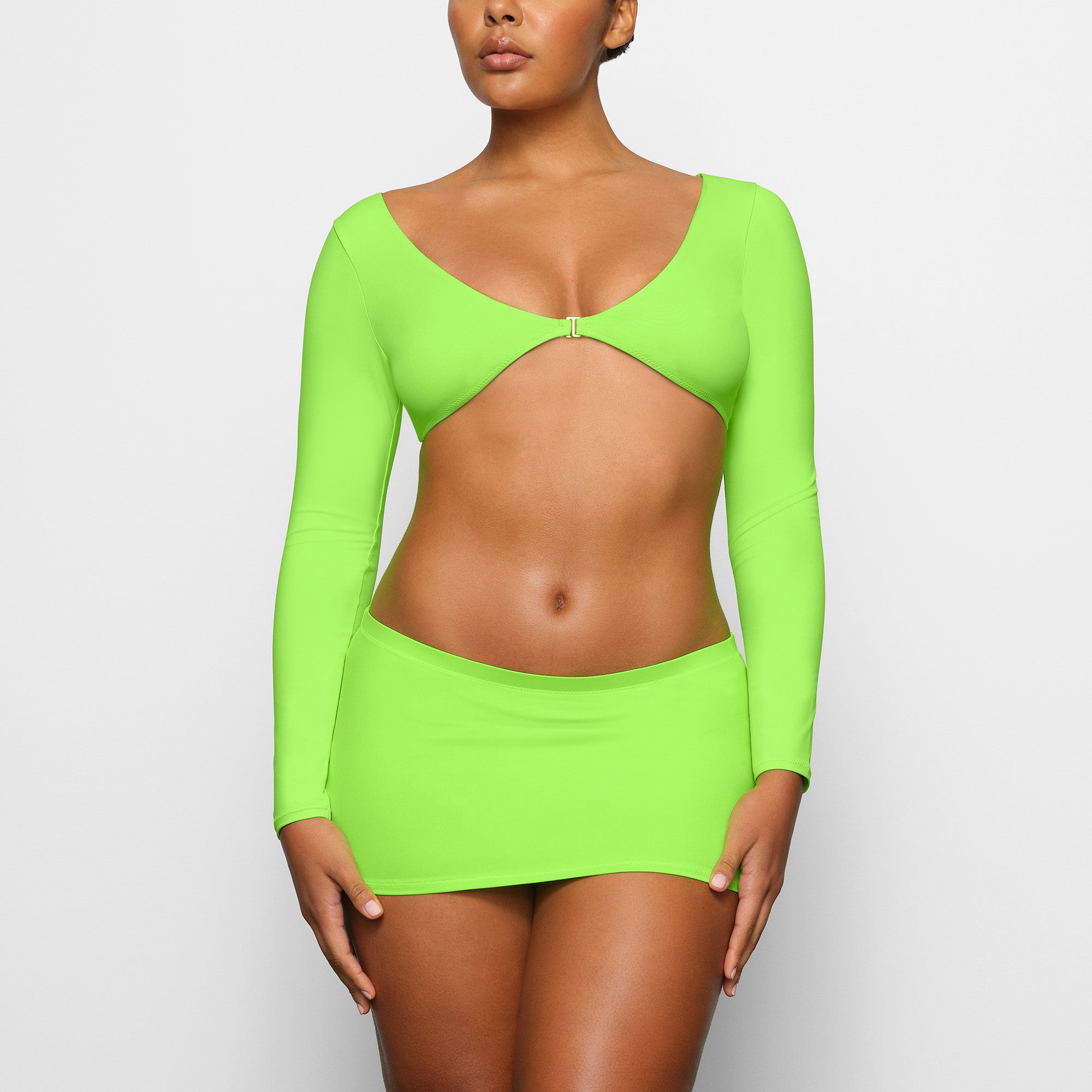 SWIM LONG SLEEVE SHRUG WORN BY A MODEL IN FRONT VIEW | SEE: M, L, XL