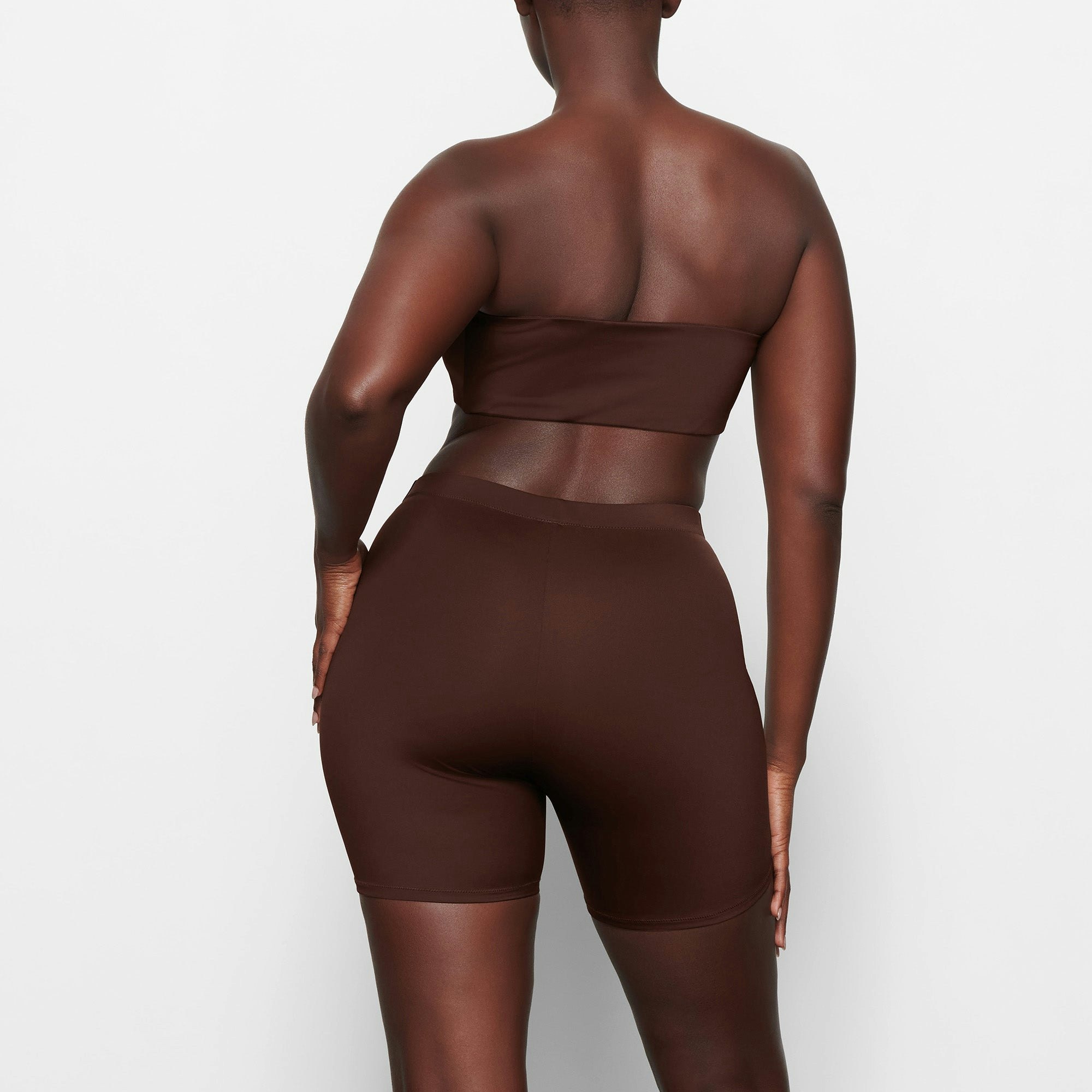 SWIM MID WAIST SHORTS ON A MODEL BACK VIEW