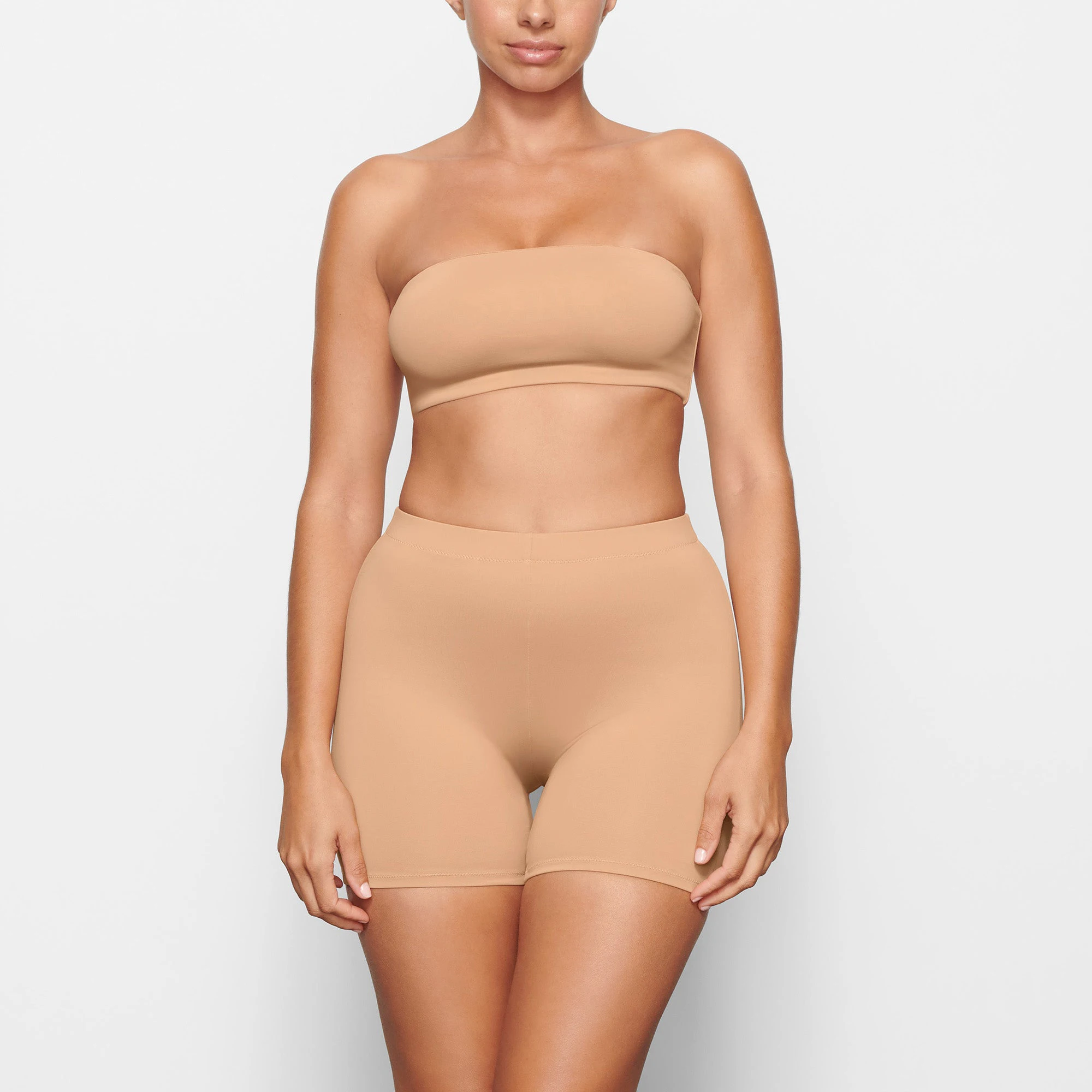 SWIM MID WAIST SHORT WORN BY A MODEL IN FRONT VIEW