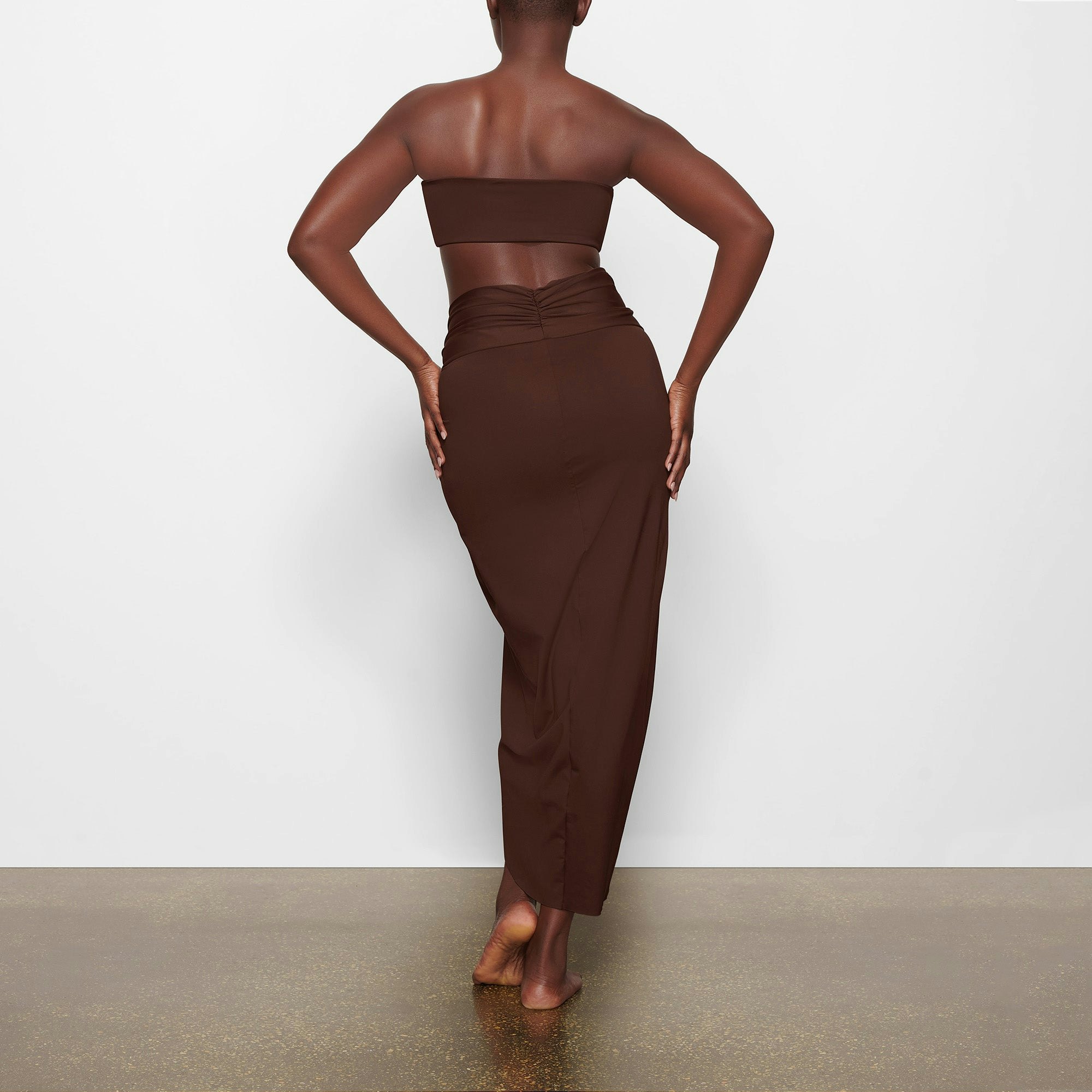 SWIM SARONG SKIRT ON A MODEL BACK VIEW