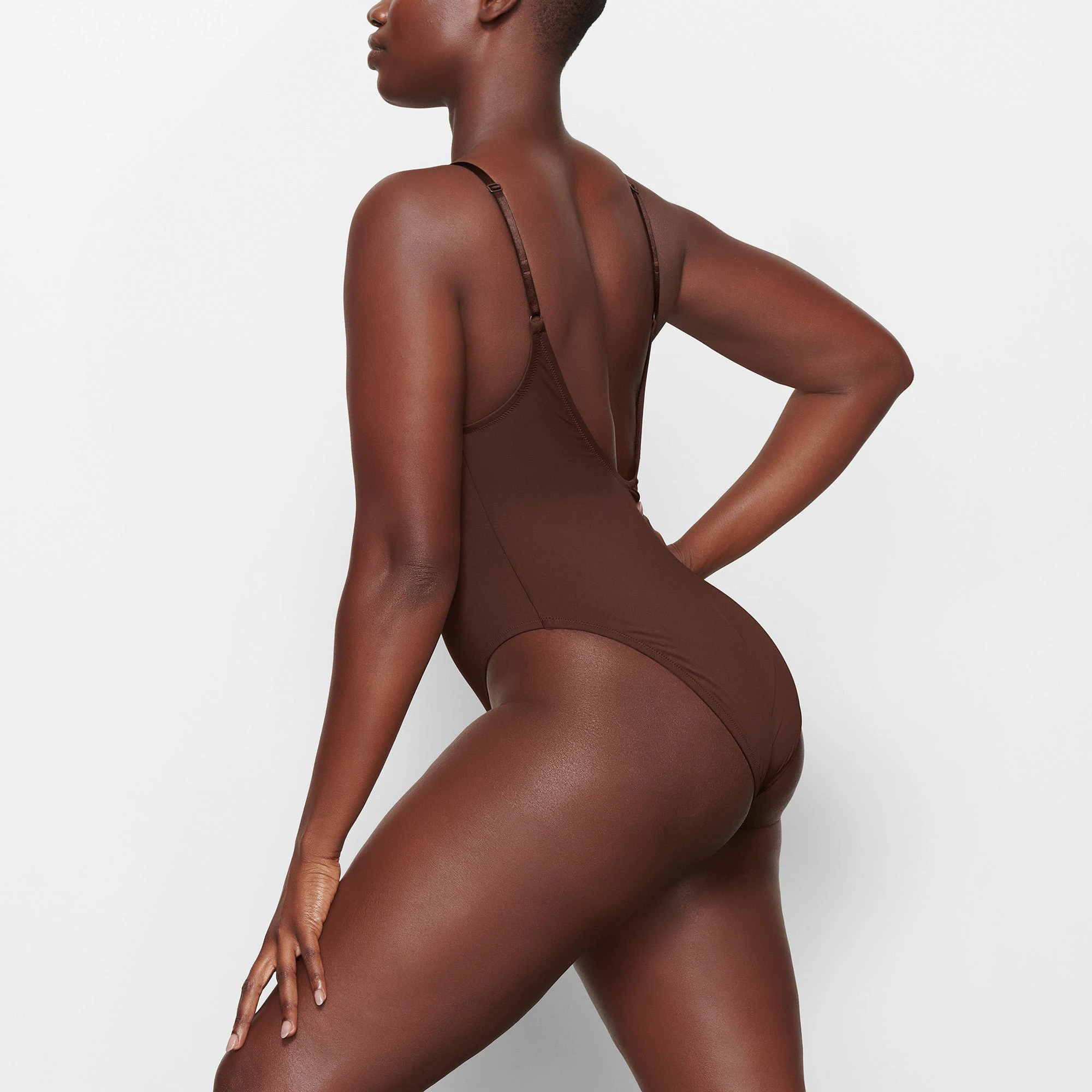 SWIM SCOOP NECK ONE PIECE WORN BY A MODEL IN SIDE VIEW